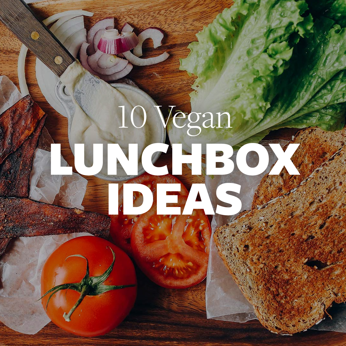 Sandwich fixings on a wood cutting board for our 10 Vegan Lunchbox Ideas roundup
