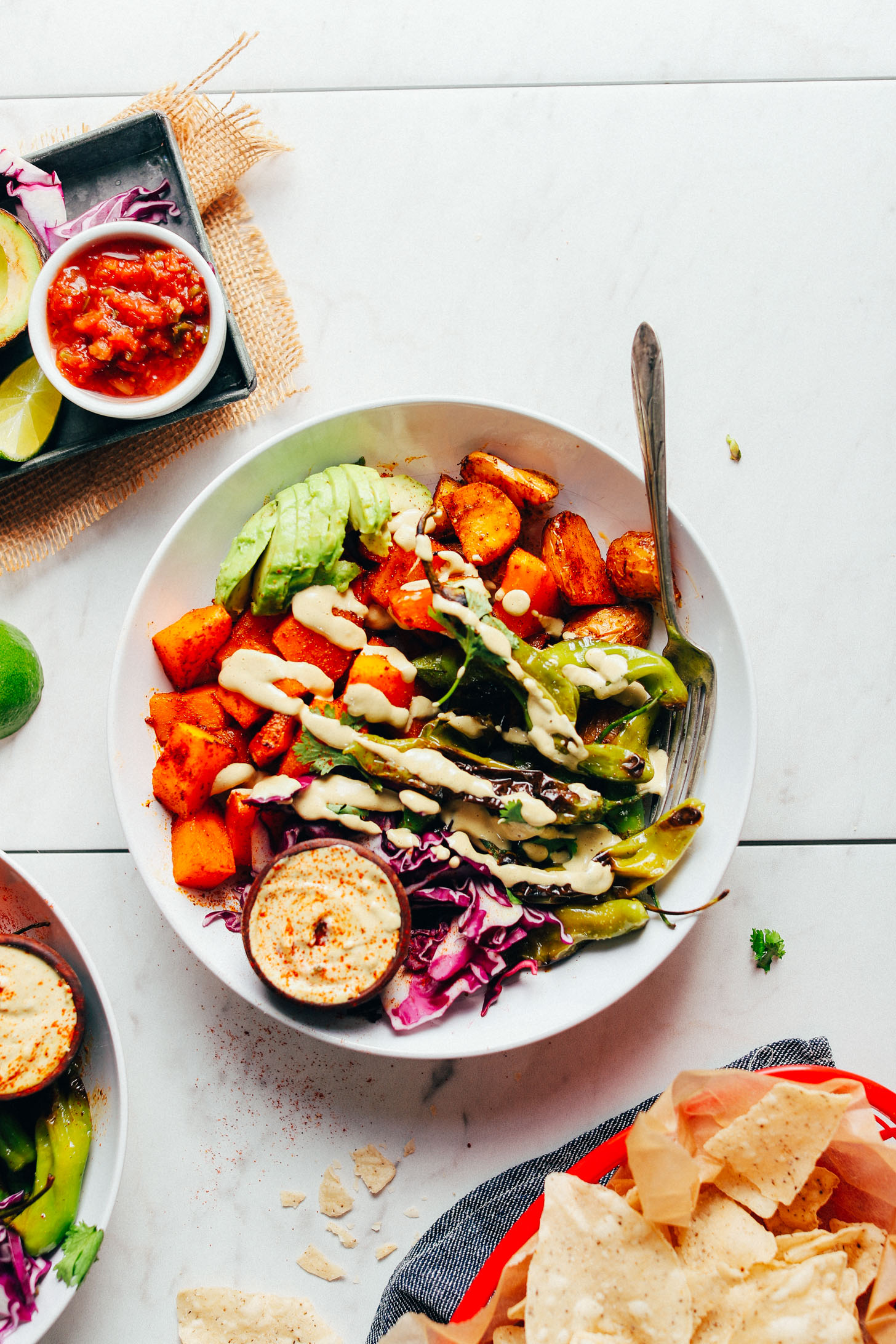 AMAZING Roasted Butternut Squash Bowl full of fall-inspired veggies and drizzled with vegan queso