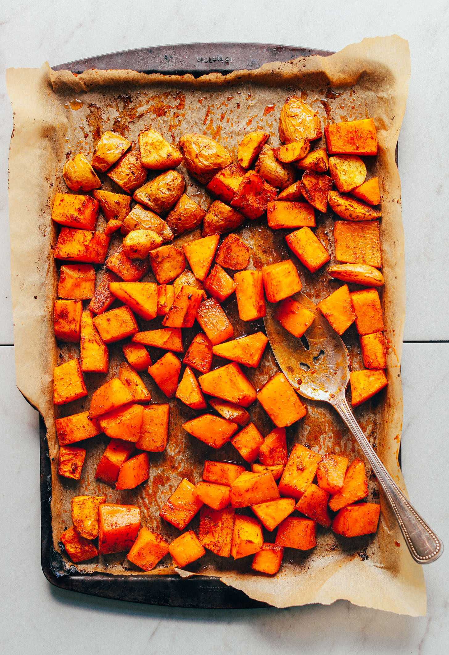 Tray of freshly roasted potatoes and butternut squash