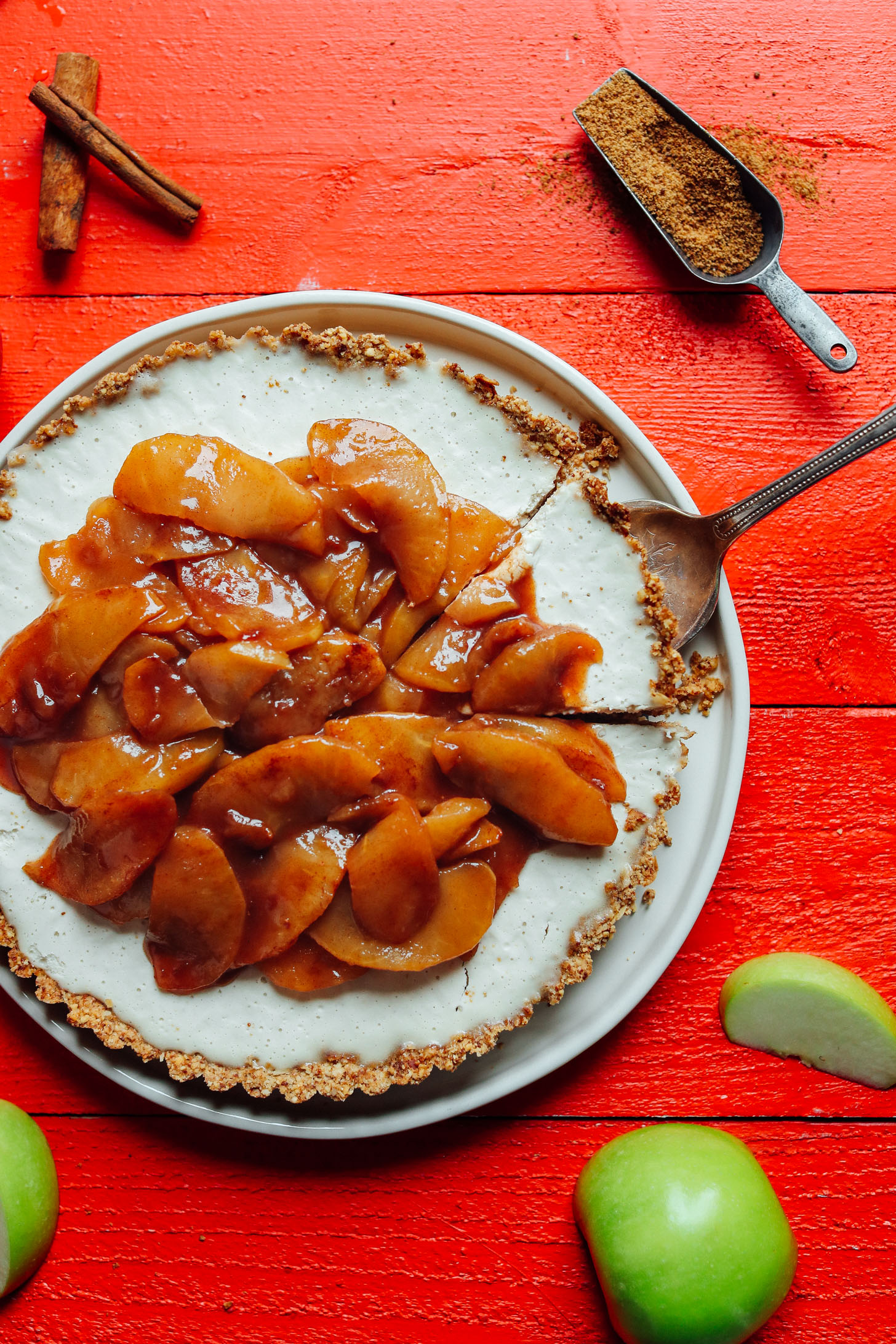Grabbing a slice of delicious, naturally sweetened Caramel Apple Tart from the serving platter