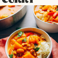 Bowl of vegan pumpkin yellow curry with text above it that says 1 pot and so easy