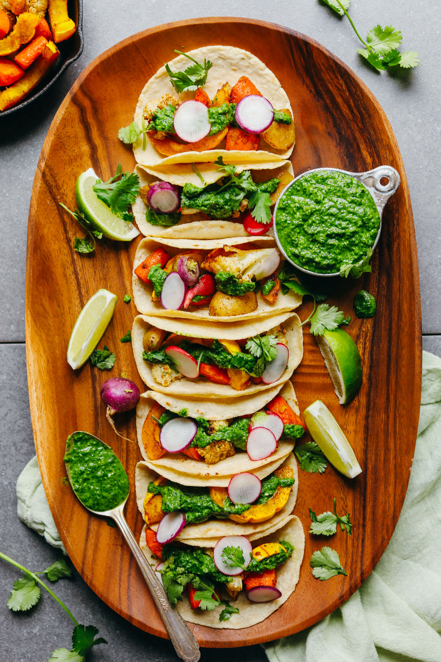 A large platter filled with gluten-free 30-Minute Roasted Vegetable Tacos with Chimichurri