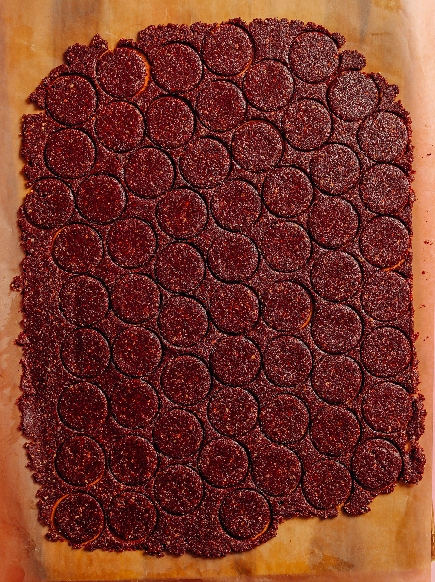 Raw Oreo Cookie Dough cut into small circles using a cookie cutter