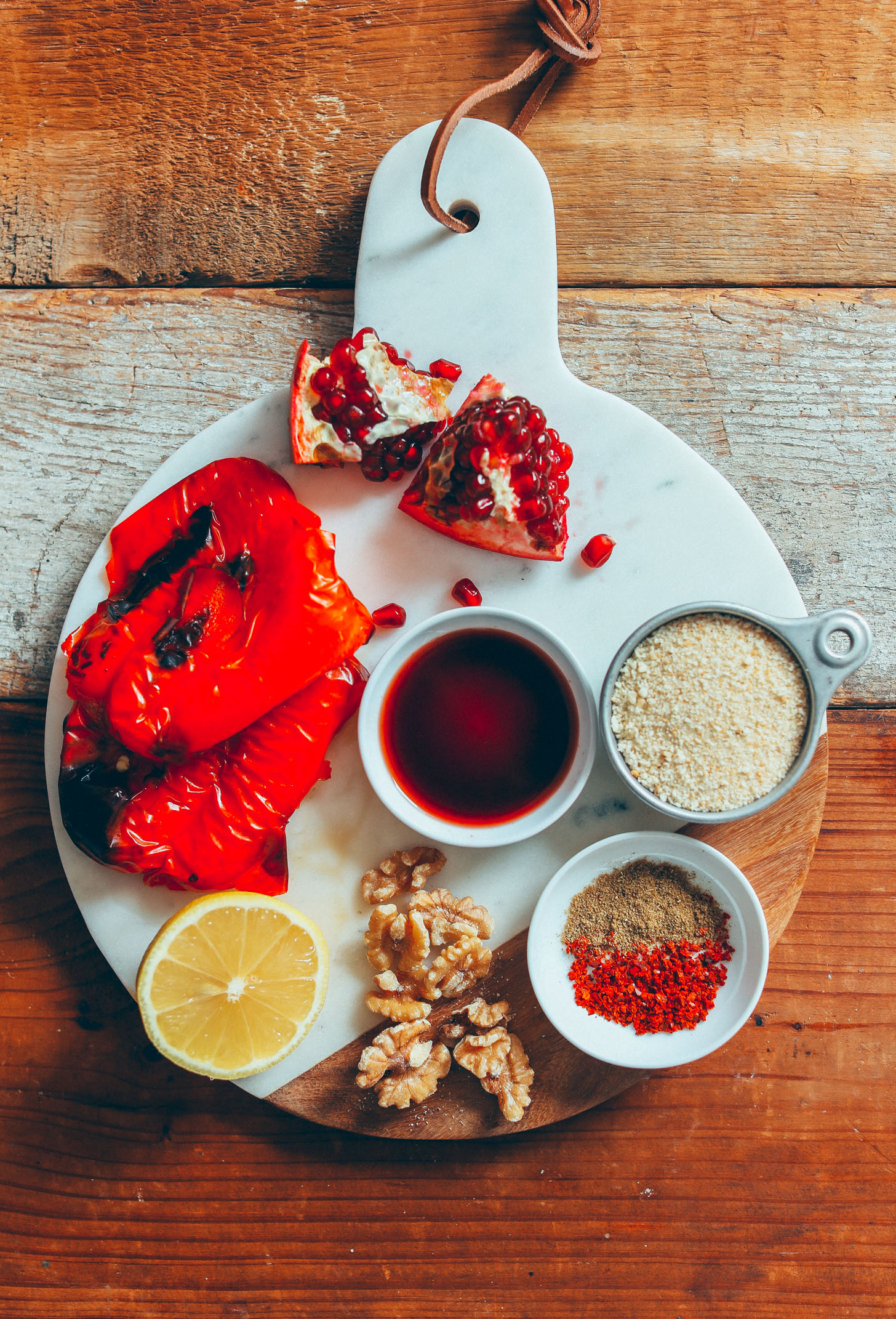 Roasted red pepper, lemon, walnuts, pomegranate molasses, breadcrumbs, and spices for making Gluten-Free Muhamarra Dip