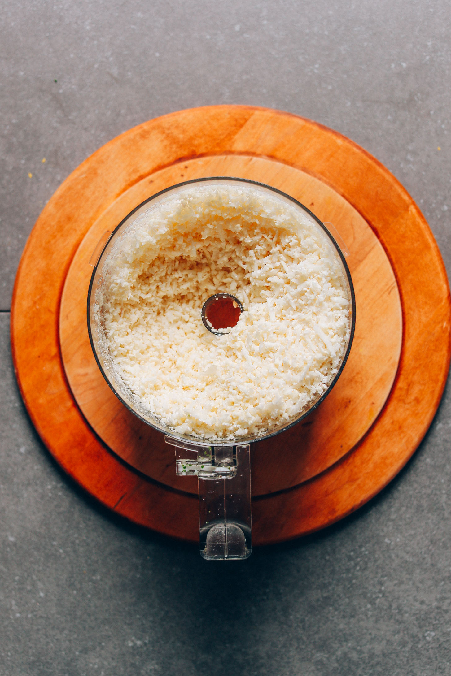 Food processor filled with cauliflower rice