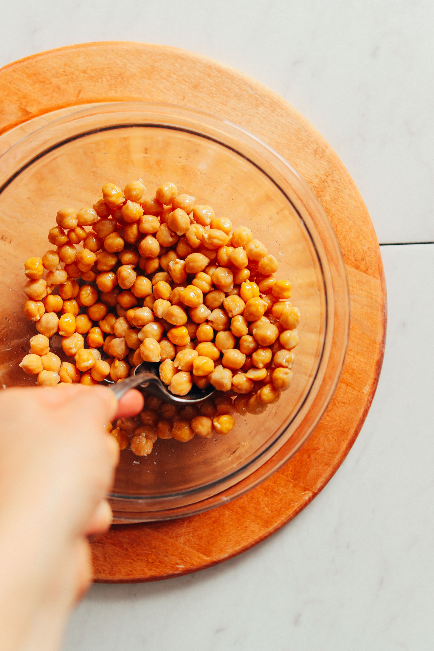 A mixing bowl of chickpeas that have had skins removed for making our Crispy Roasted Chickpeas recipe