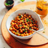 Bowl of our EASY Crispy Roasted Chickpeas perfect for snacking or topping plant-based salads