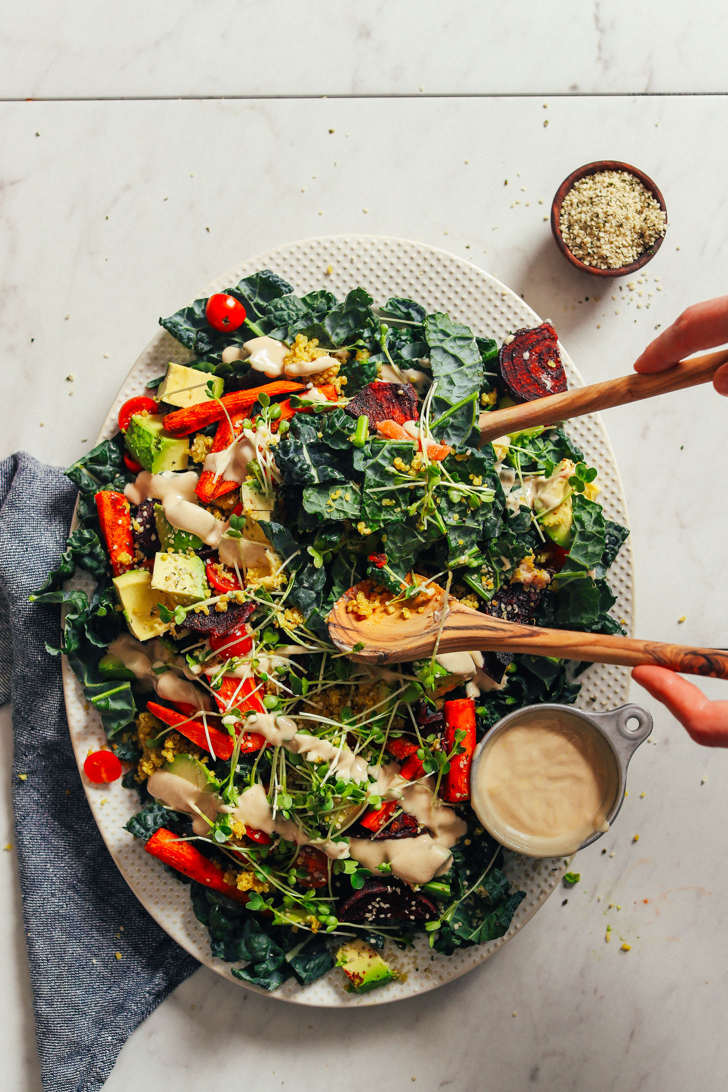 HEALTHY Loaded Kale Salad in just 55 minutes! Roasted and fresh veggies, sprouts, quinoa, and tahini dressing! #dinner #vegan #glutenfree #salad #healthy #minimalistbaker #recipe