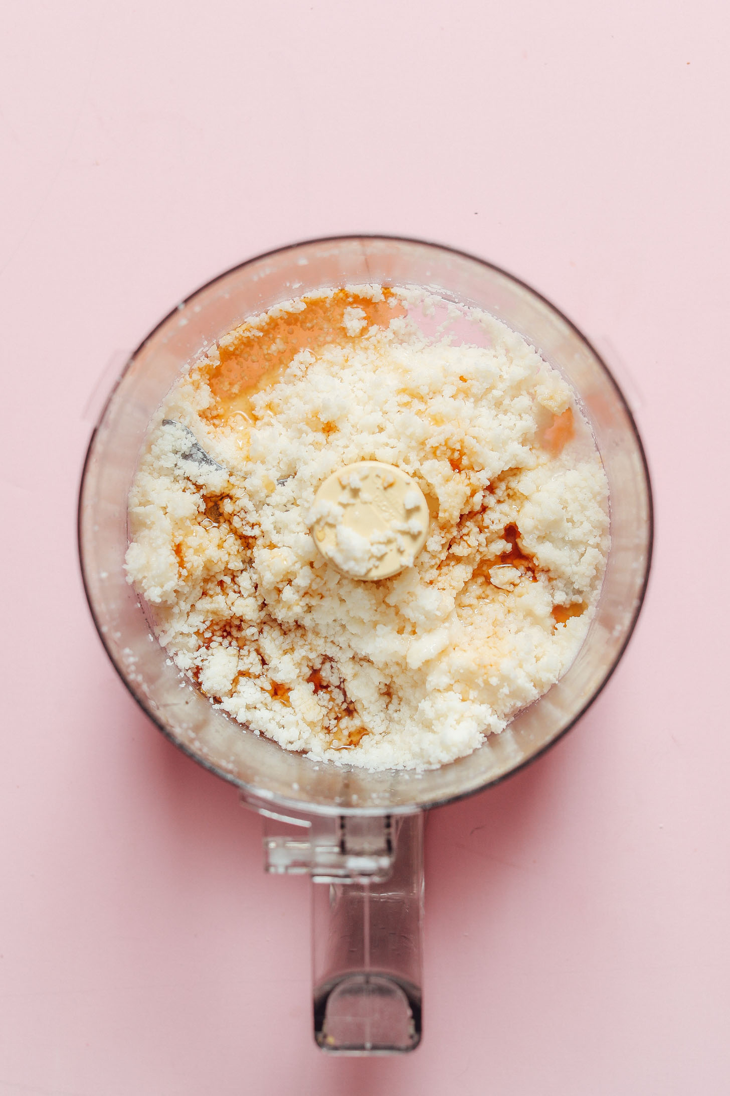 Food processor with coconut and other ingredients for making naturally-sweetened Coconut Cookies