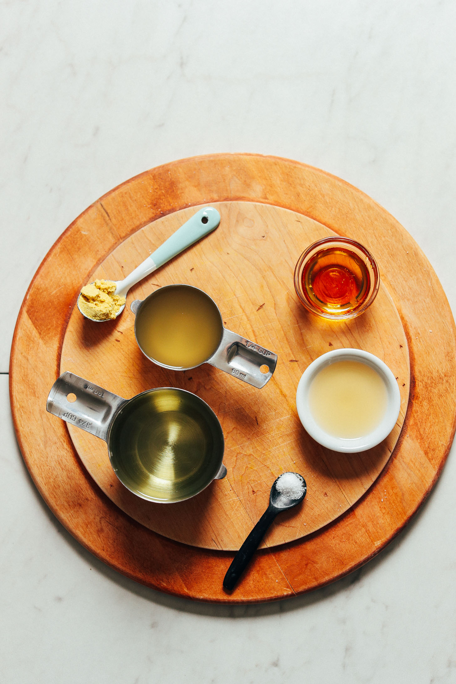 Oil, aquafaba, brown rice syrup, and other ingredients for homemade vegan mayo