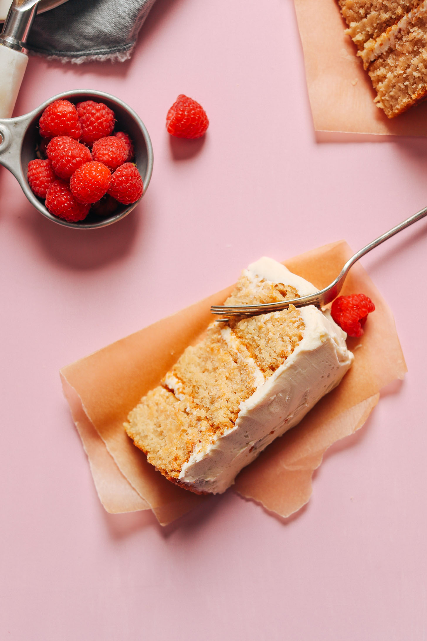 Using a fork to cut into a slice of our 1-Bowl Vegan Gluten-Free Vanilla Cake