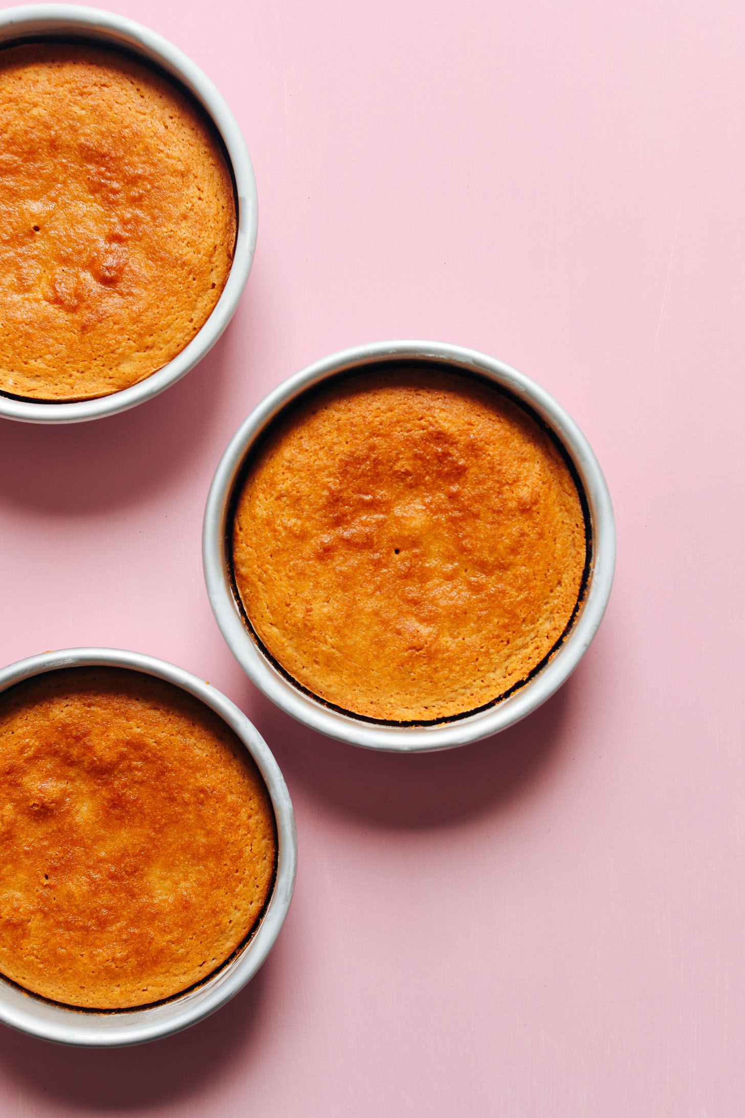 Freshly baked 1-Bowl Vanilla Cake layers in round baking pans