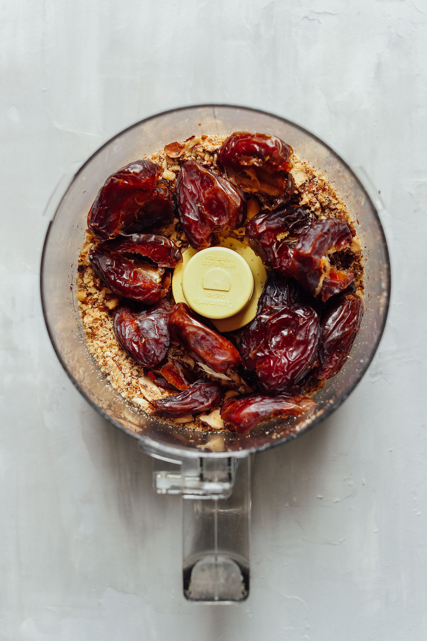 Food processor with pulsed walnuts and freshly pitted dates