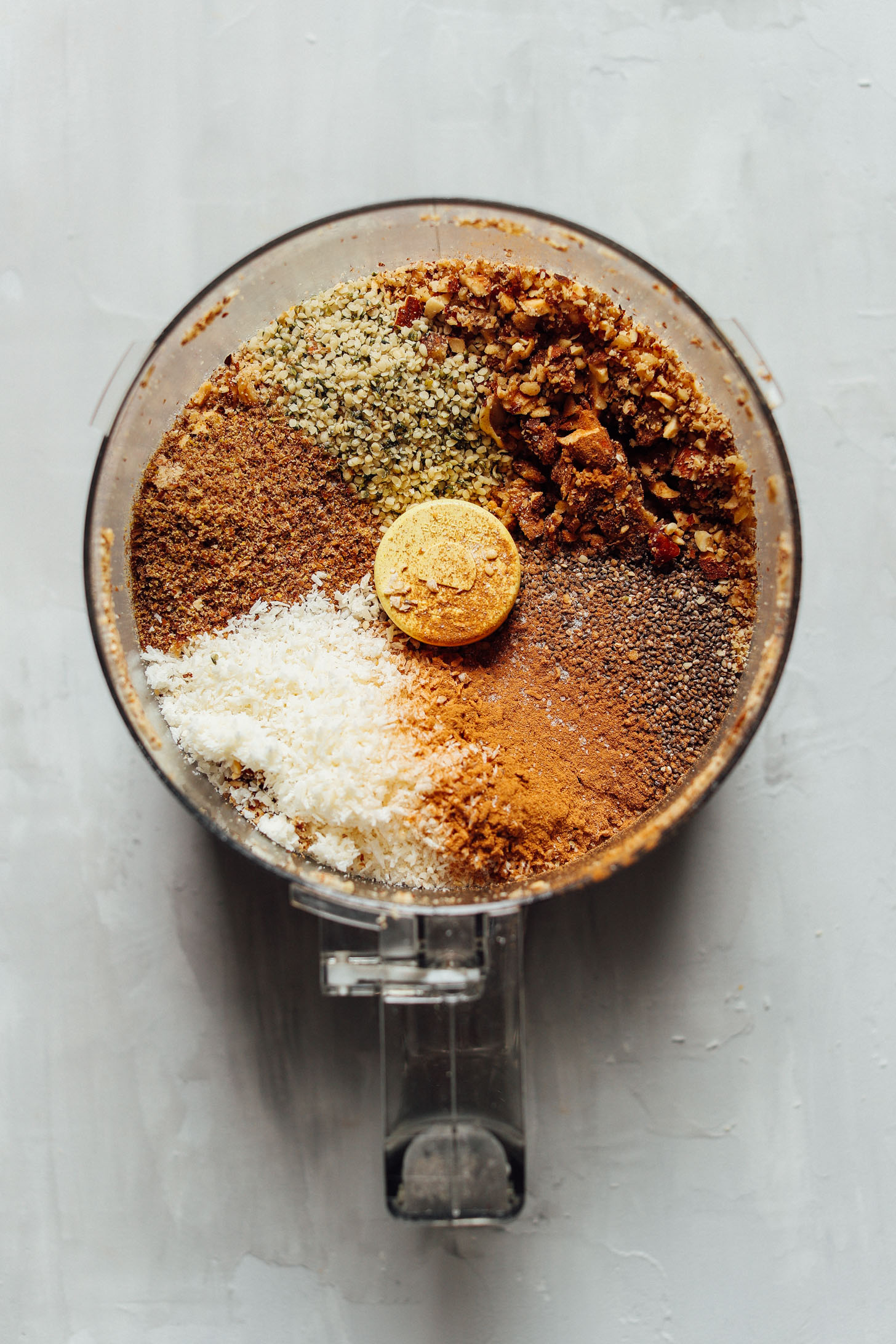All the ingredients in the food processor for making our gluten-free raw granola recipe