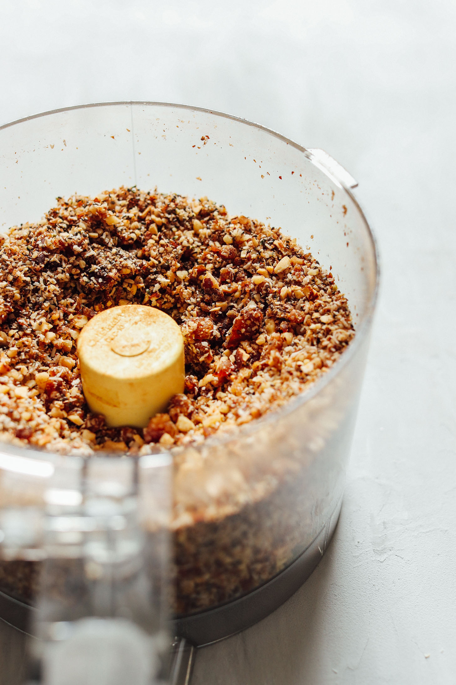 Food processor with freshly pulsed plant-based Rawnola