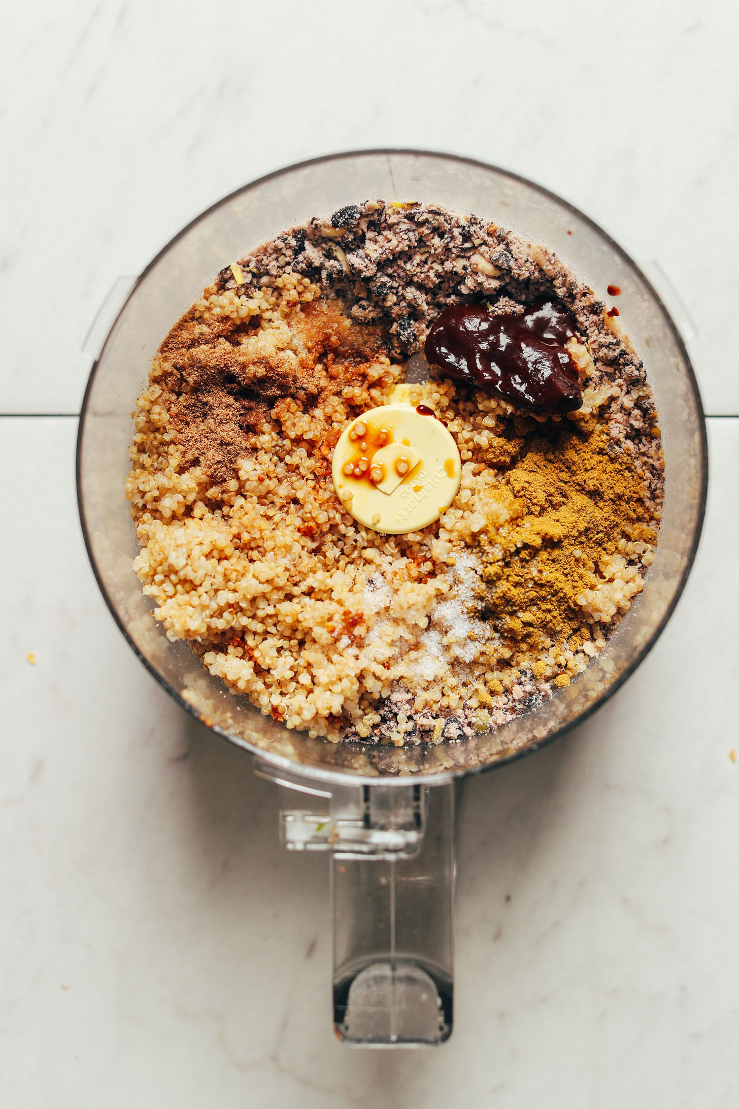 All the ingredients in the food processor for gluten free and vegan Black Bean Quinoa Falafel