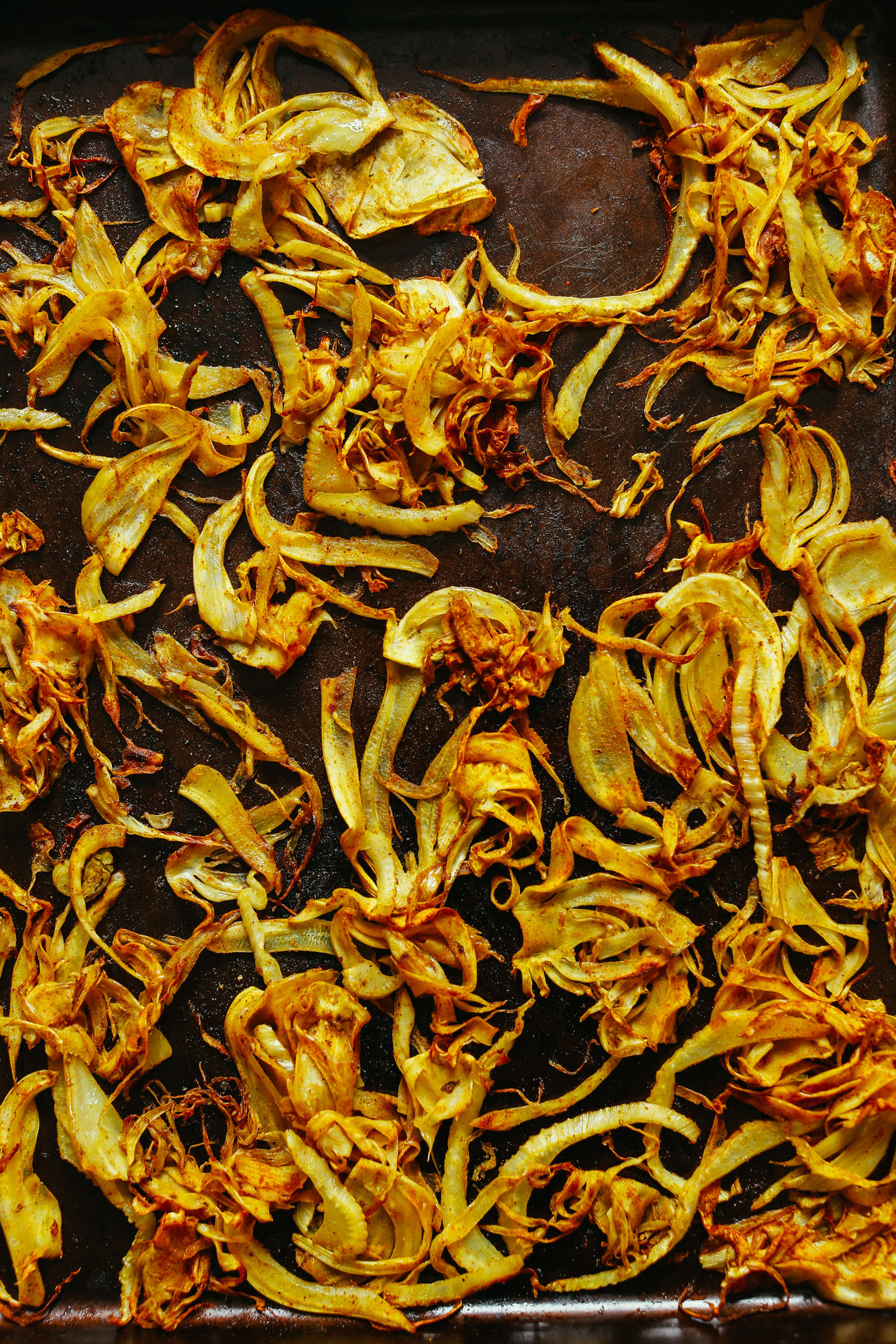 Curry Roasted Fennel freshly out of the oven on a baking sheet