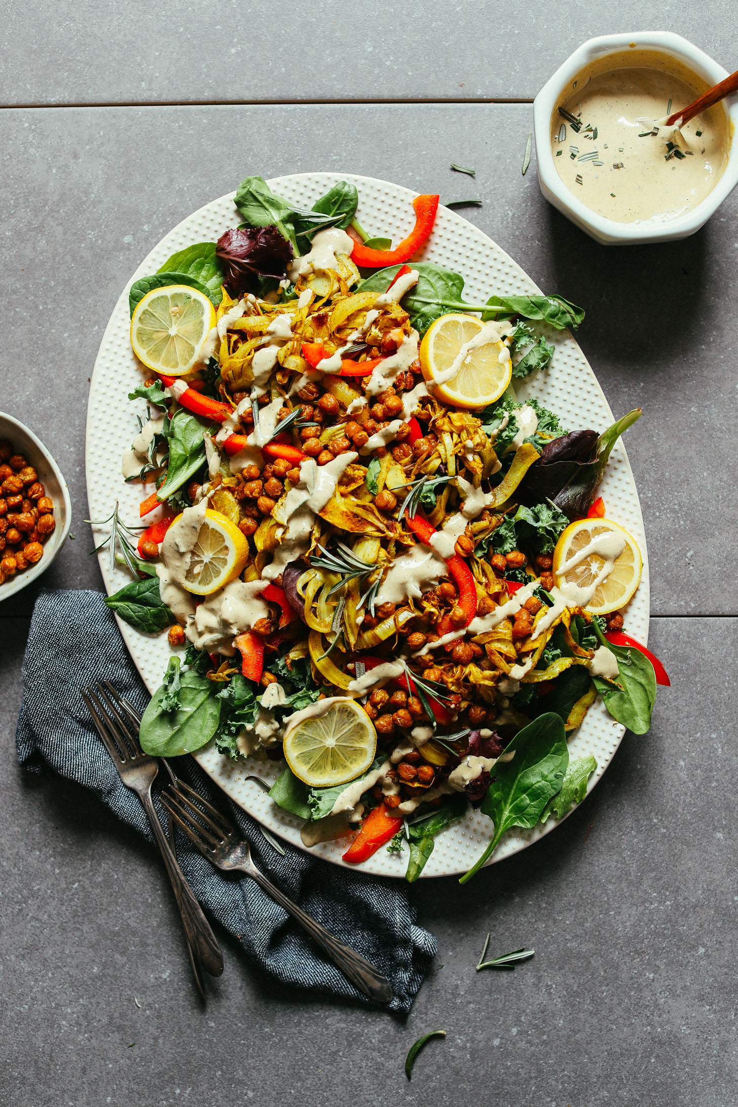 Large serving platter of Curry Roasted Fennel Salad complete with fresh greens and crunchy chickpeas