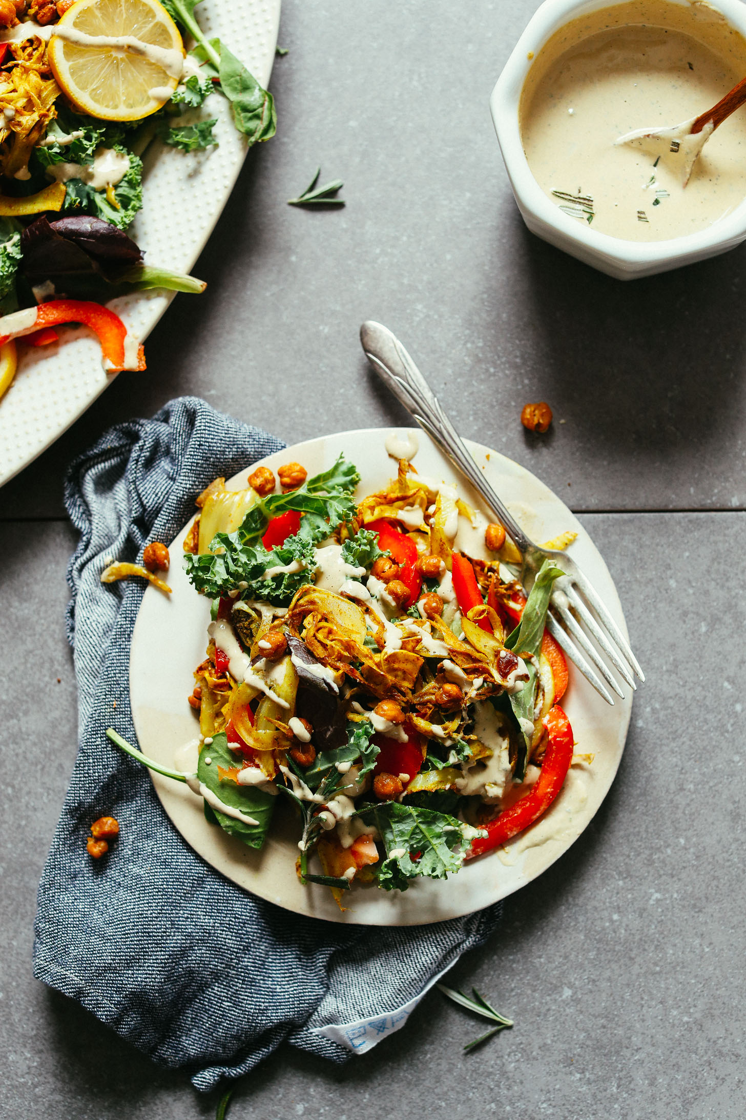 Colorful plate filled with Curry Roasted Fennel Salad with Rosemary Tahini Dressing