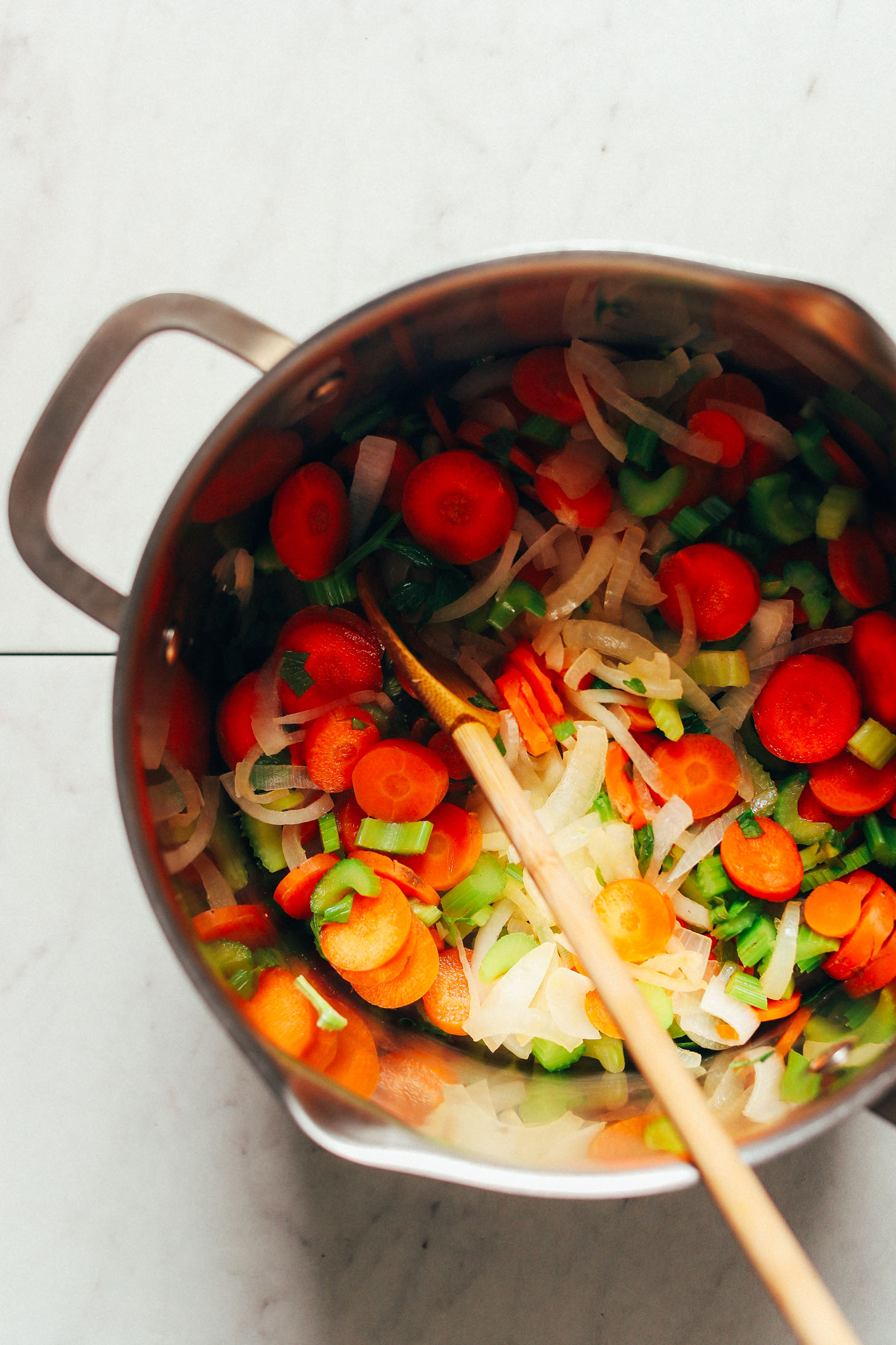 Cooking onion, celery, and carrots for our gluten-free Fire-Roasted Tomato Veggie Mung Bean Soup