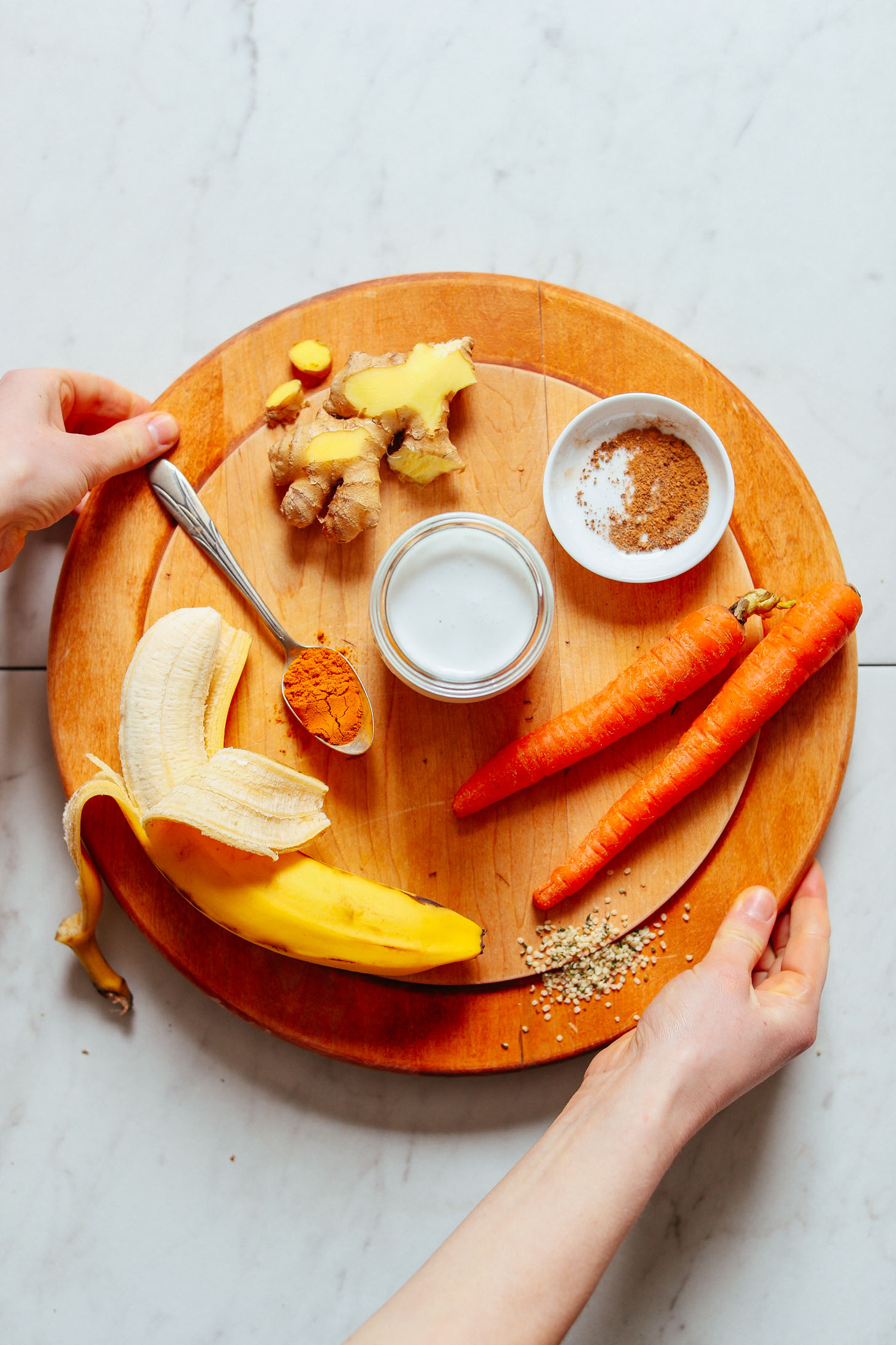 Banana, turmeric, ginger, carrots, coconut milk, and warming spices for making our Vegan Golden Milk Smoothie