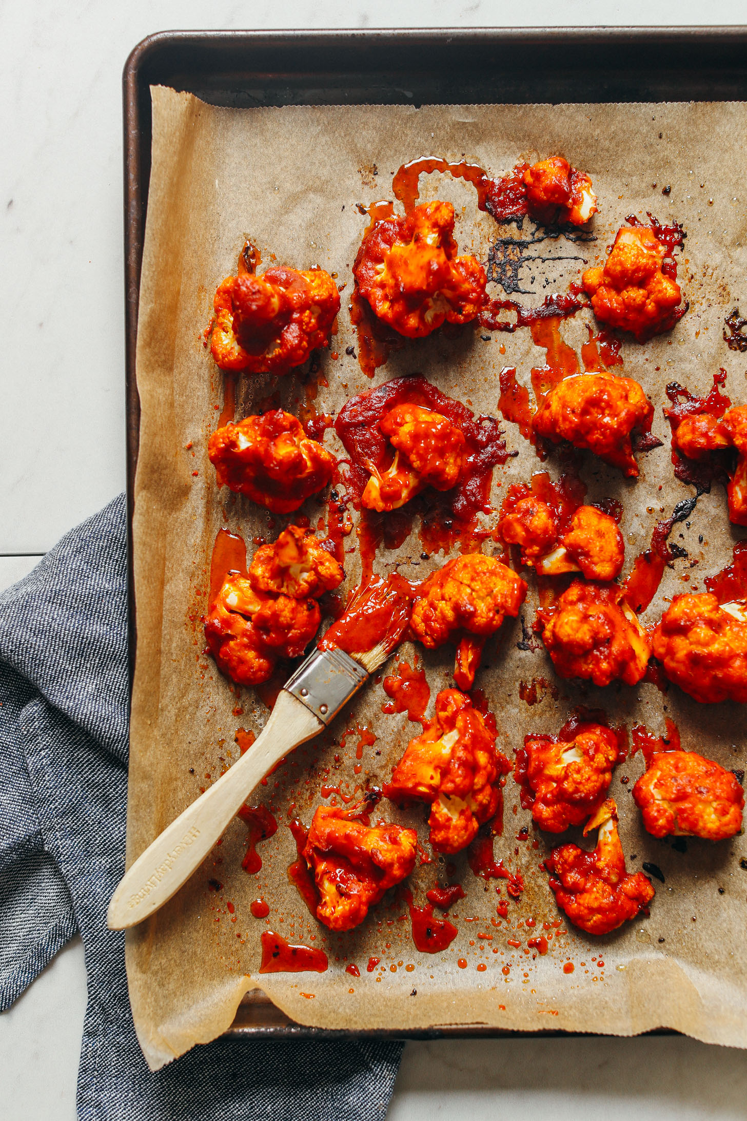 Freshly roasted Korean-Spiced Cauliflower with an extra slather of sauce
