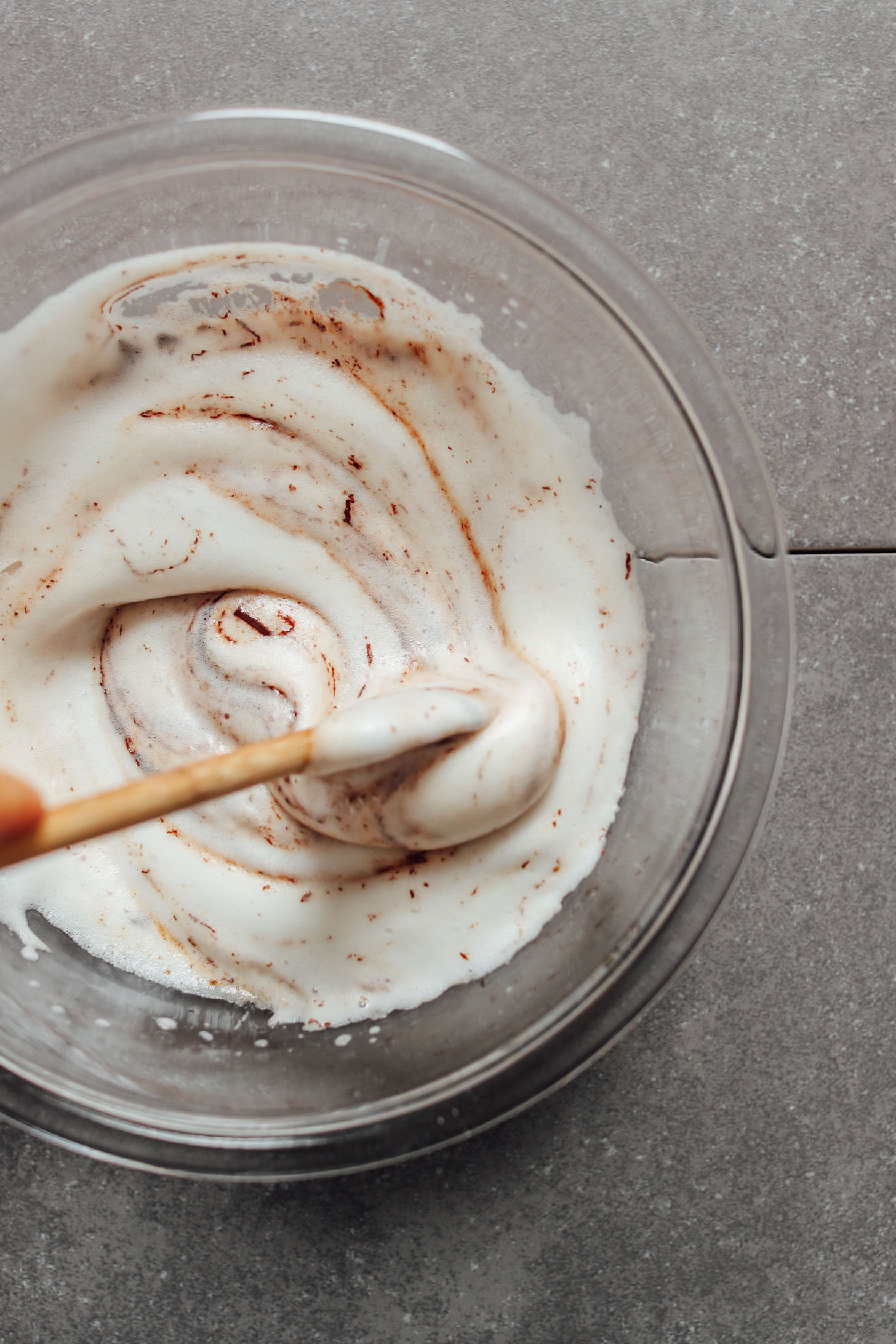 Mixing bowl with freshly whipped aquafaba for gluten-free Vegan Brownie Cookies