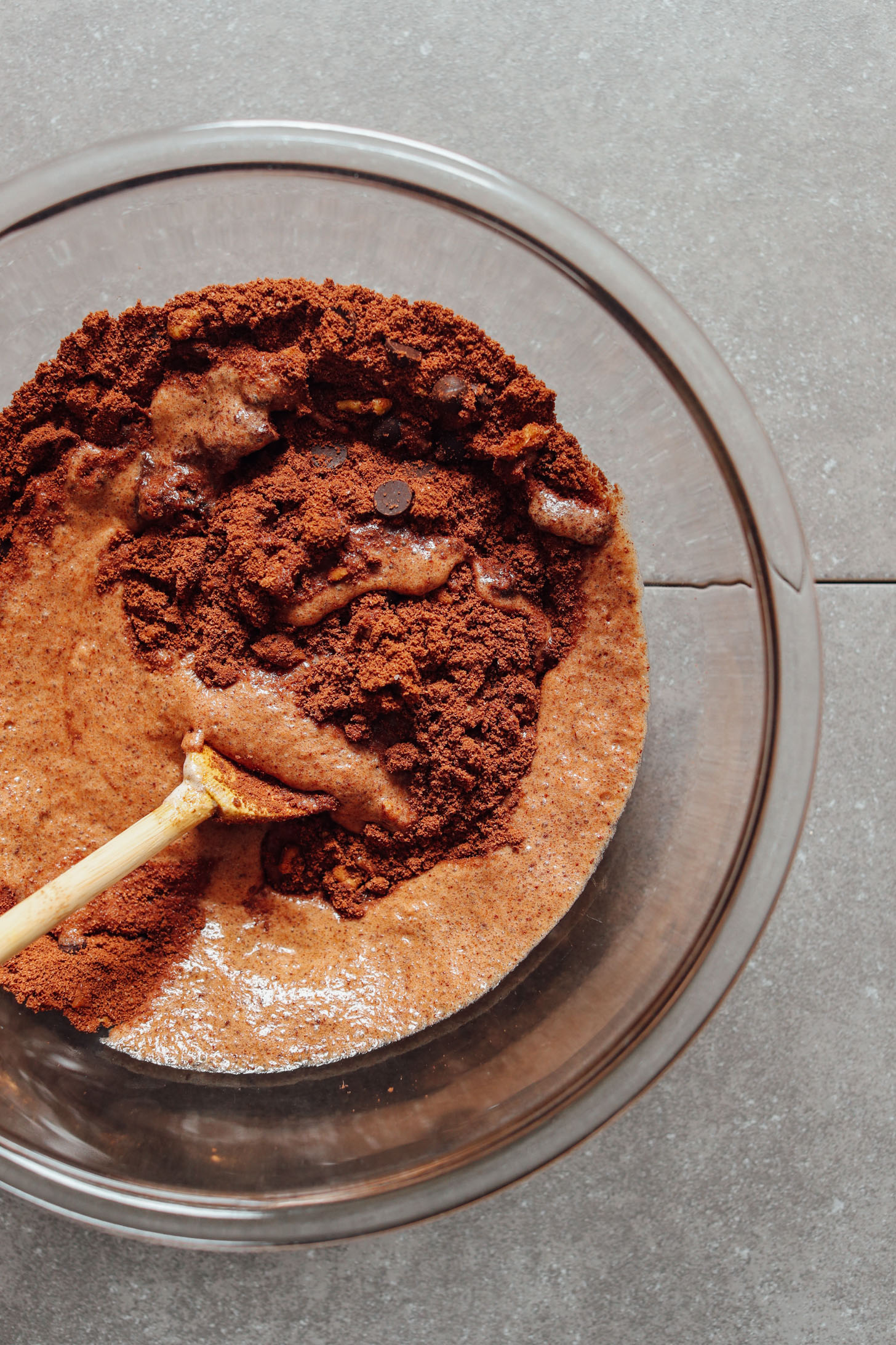 Stirring together the wet and dry ingredients for these easy to make gluten-free Vegan Brownie Cookies