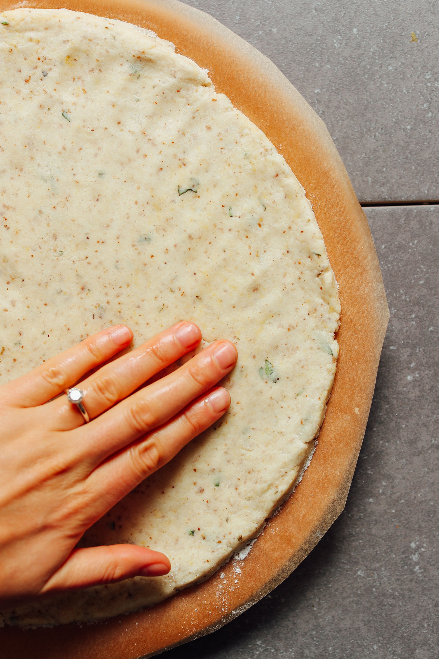 Flattening out the dough for our vegan Gluten-Free Pizza Crust