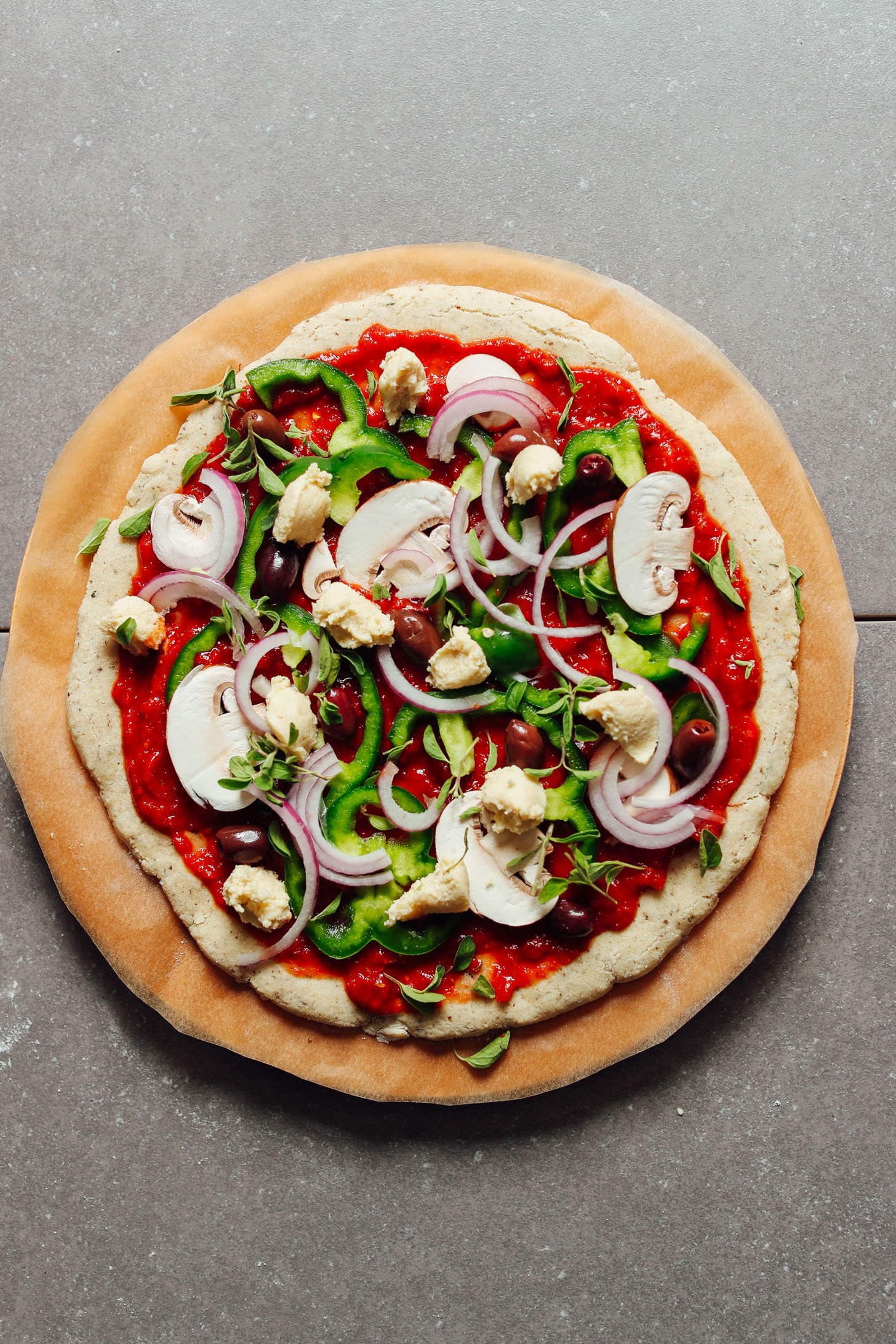 Gluten-Free Pizza Crust topped with marinara and fresh vegetables