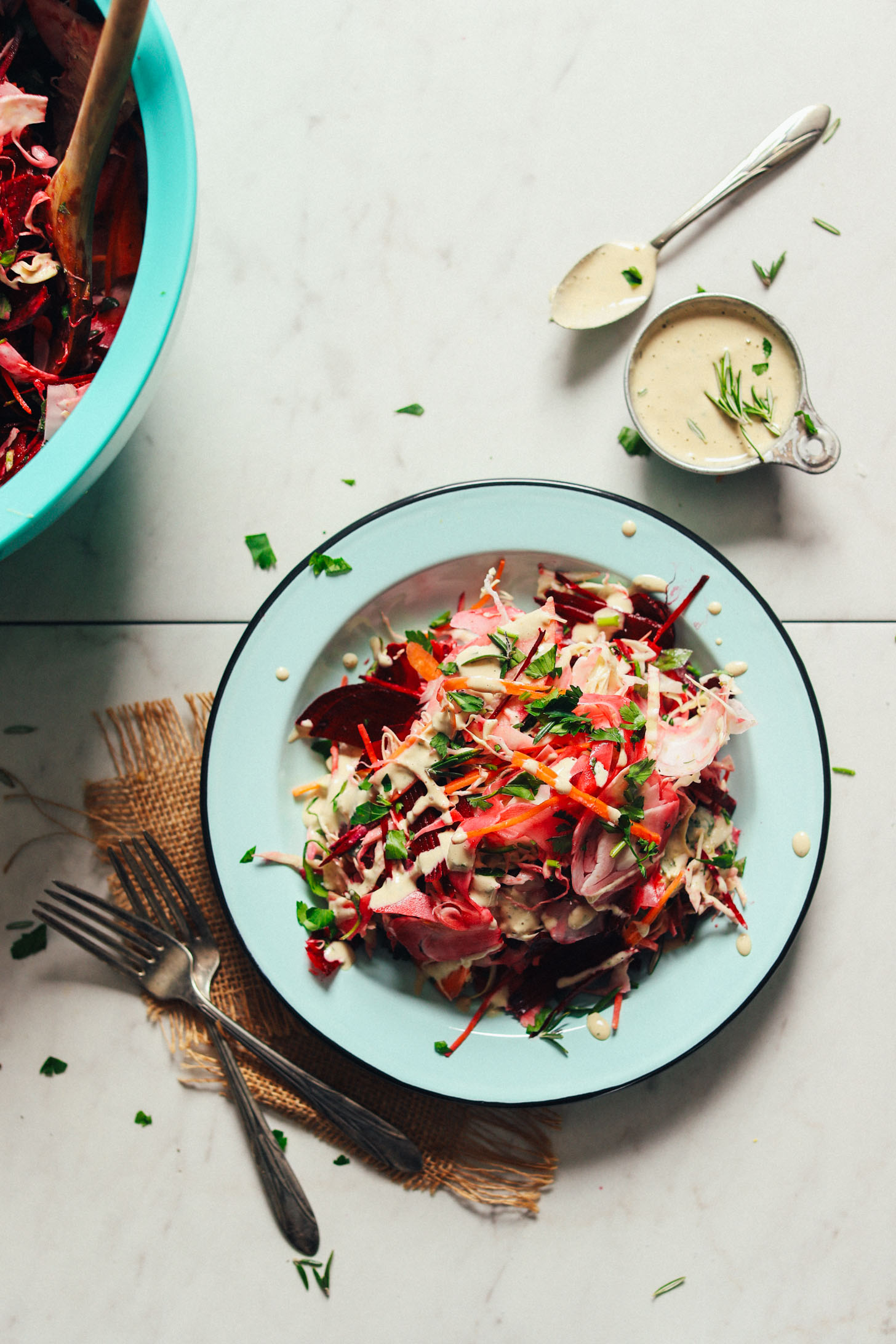 Serving plate loaded with healthy Super Cleansing Slaw with Rosemary Tahini Dressing