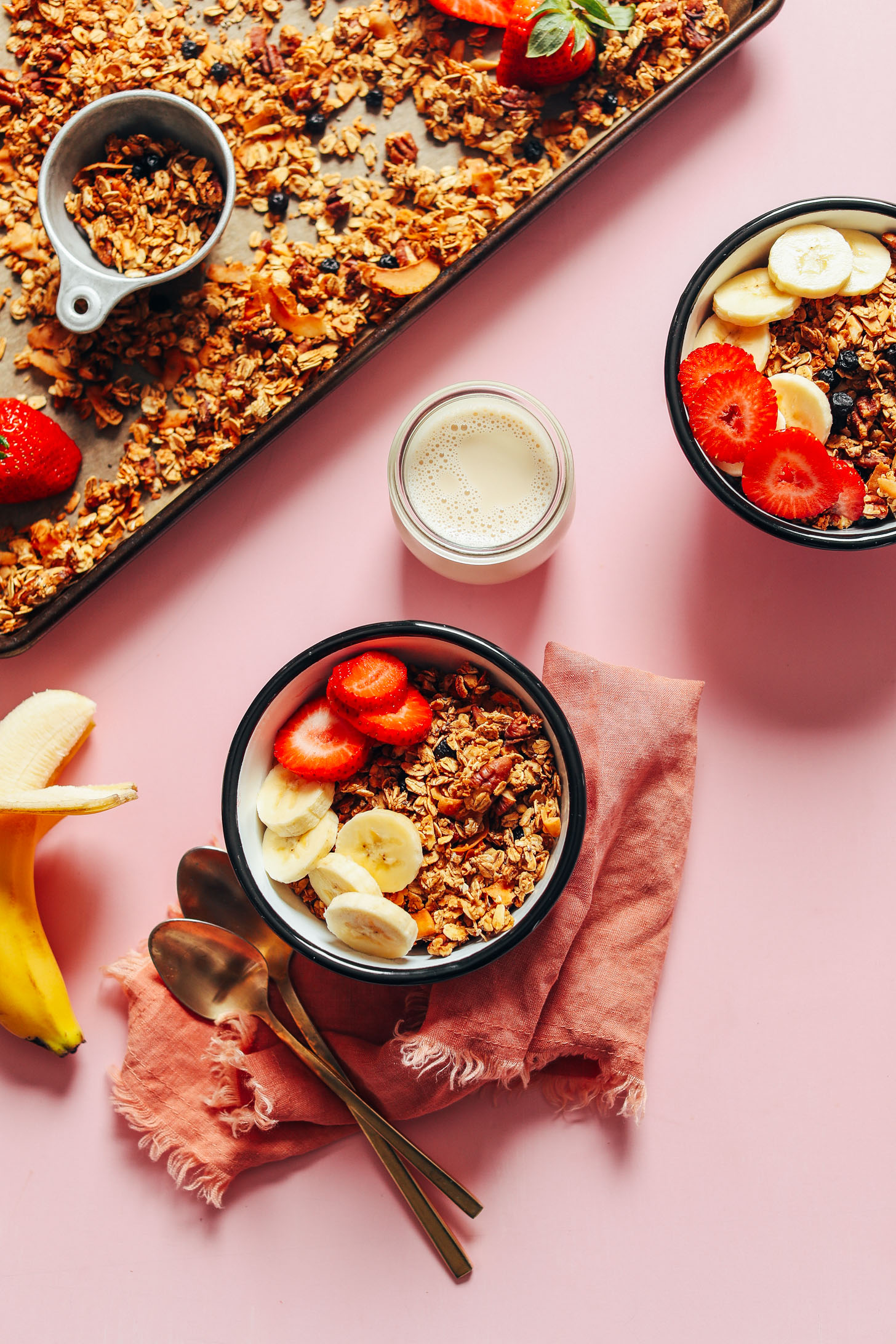 Breakfast bowls filled with crunchy naturally sweet oil-free granola topped with fresh fruit