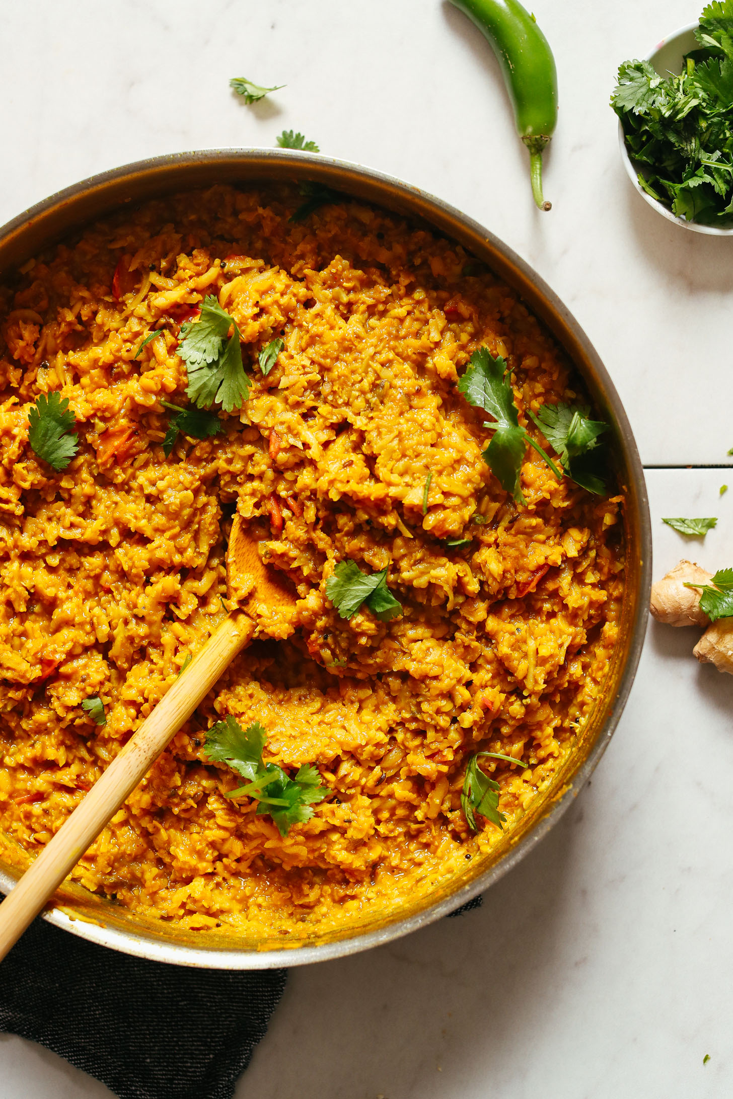 Stirring a pot of gluten-free vegan Cauliflower Rice Kitchari