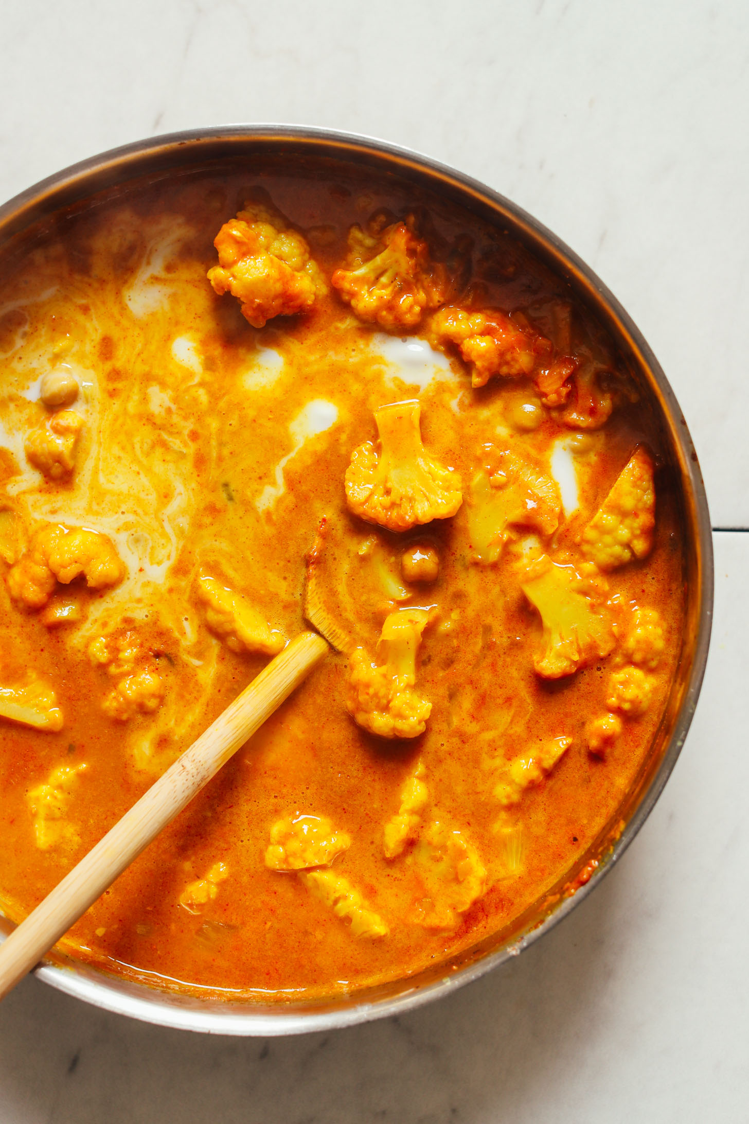 Stirring together ingredients for a healthy plant-based curry