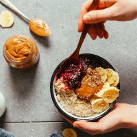 Using a spoon to grab a bite from the Perfect Bowl of Oats