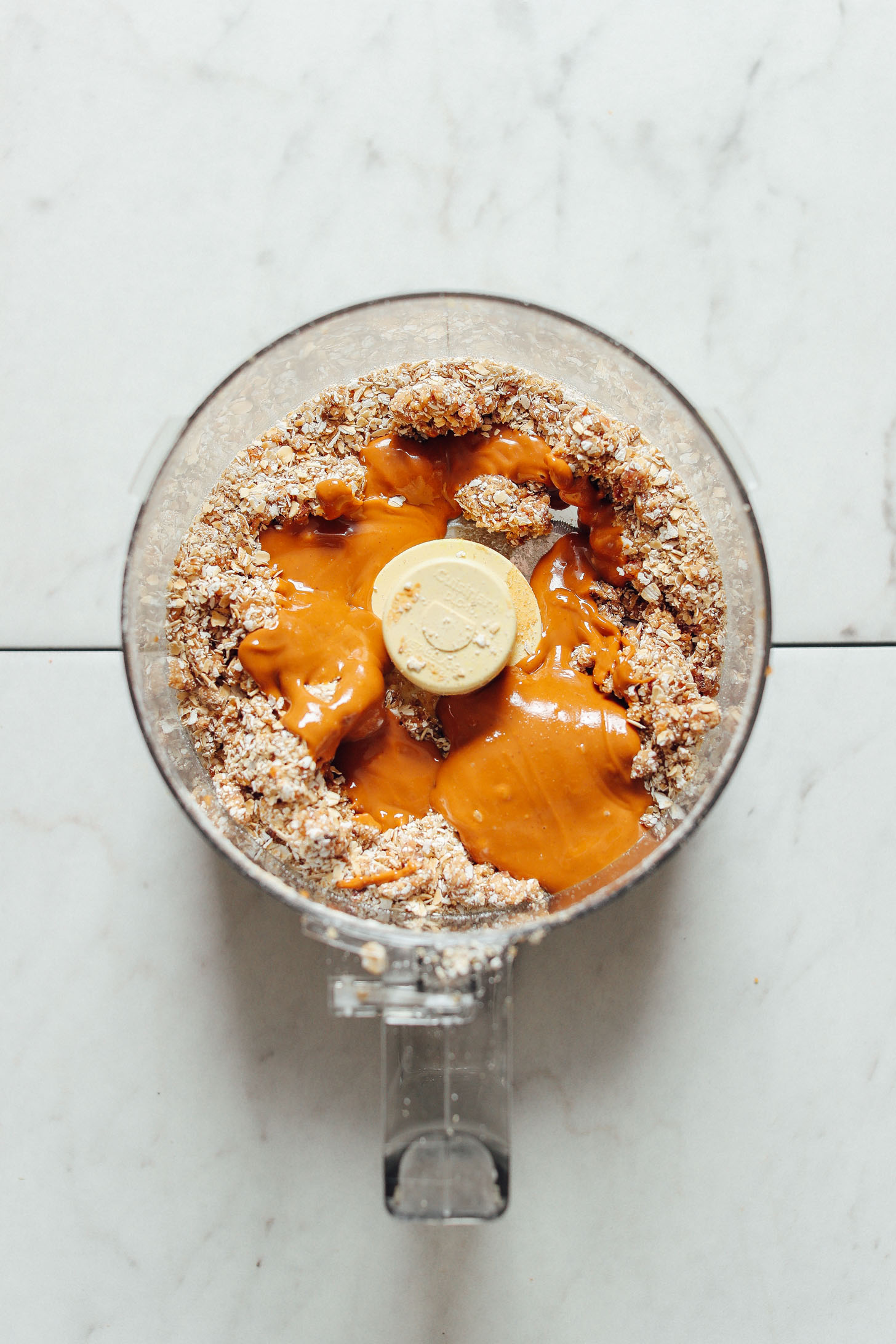 Blender with ingredients for making our simple gluten-free vegan No-Bake Peanut Butter Cookies recipe