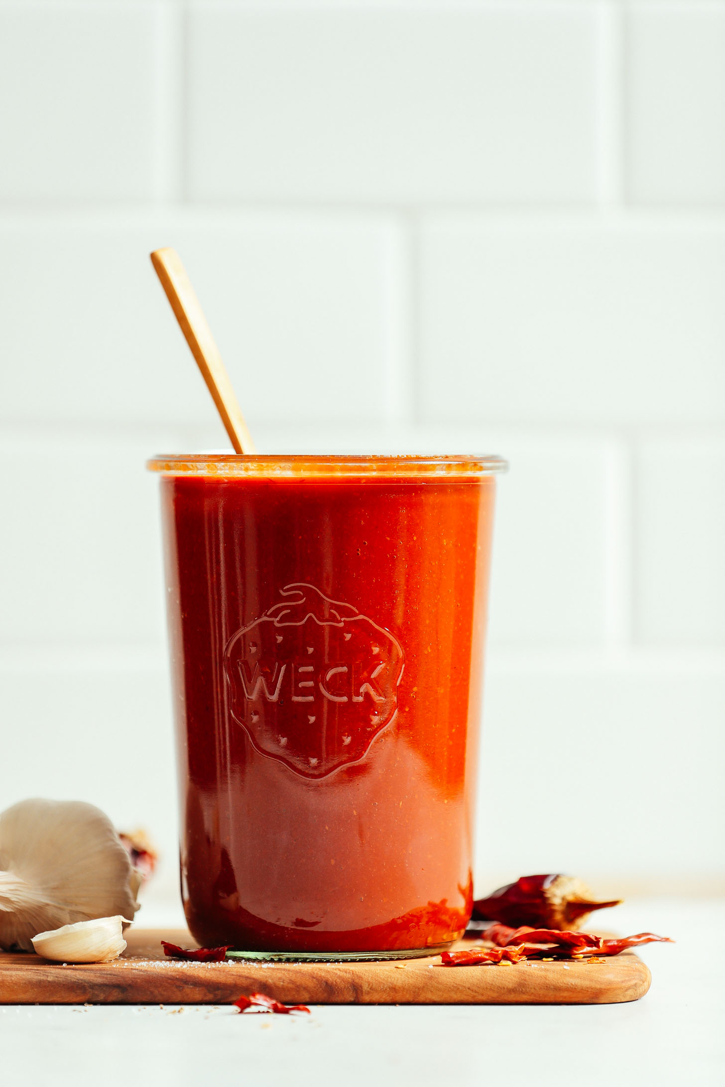 Glass quart-sized jar filled with easy homemade spicy red enchilada sauce