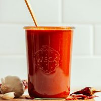 Jar filled with a batch of our homemade Red Enchilada Sauce recipe