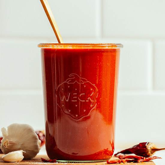 Jar filled with a batch of our homemade Red Enchilada Sauce recipe