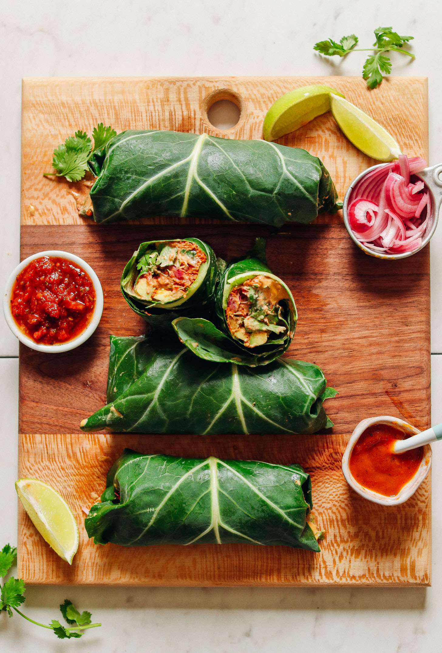 Wood cutting board with gluten-free Raw Vegan Burritos with Mexican-inspired flavor