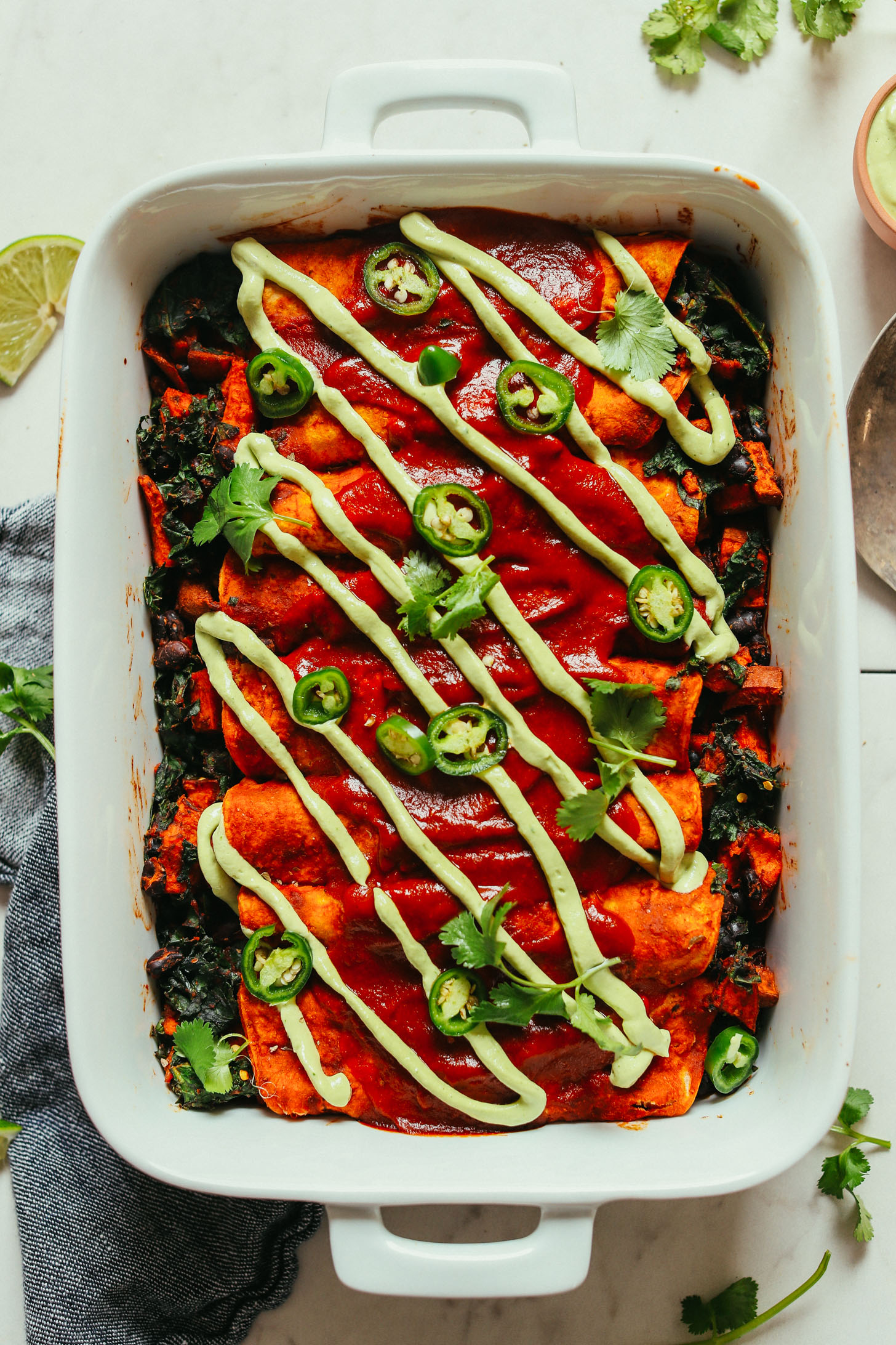 Baking Pan of gluten-free vegan Sweet Potato Black Bean Enchiladas for a satisfying plant-based meal
