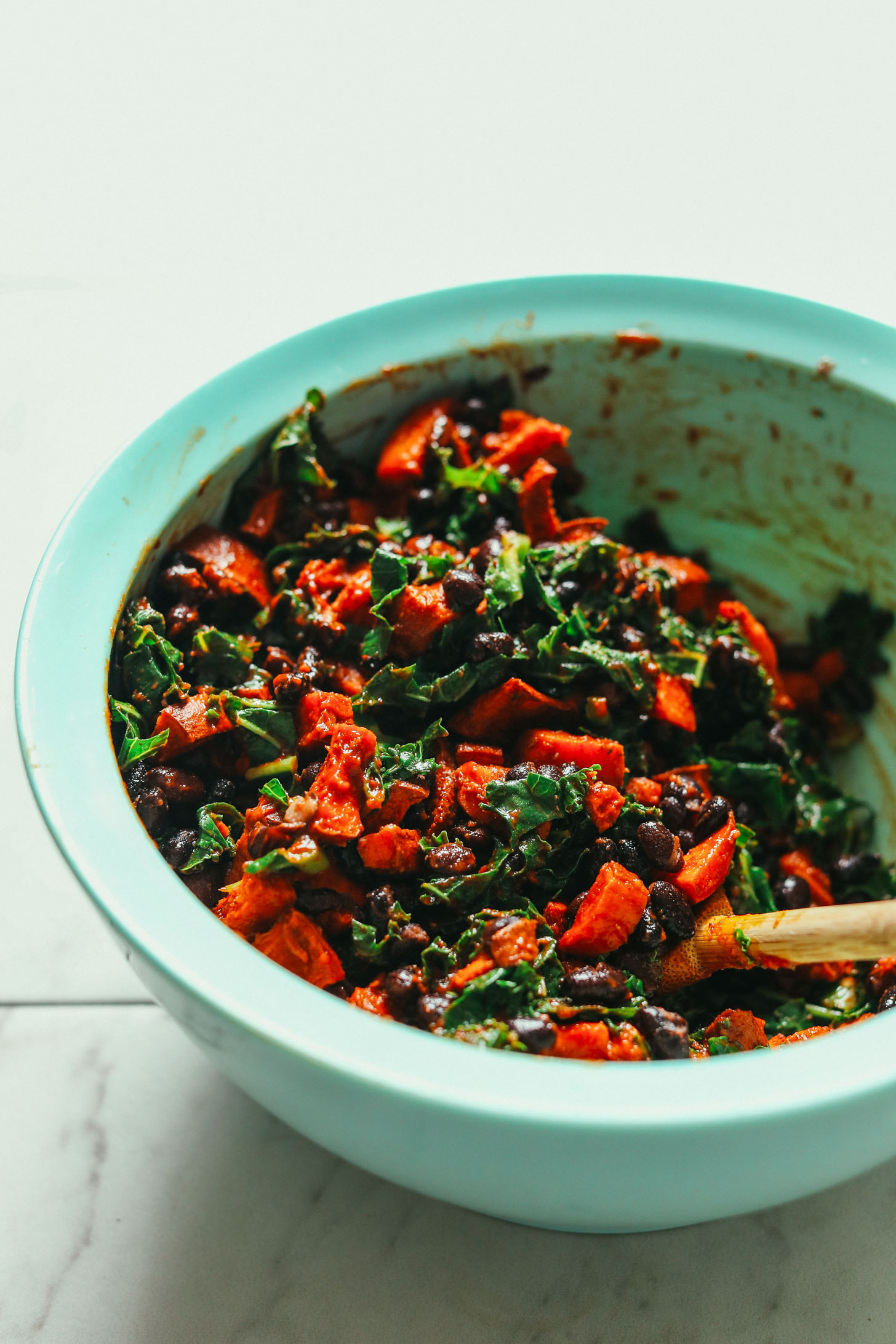 Mixing bowl with Sweet Potato Black Bean Enchilada filling ingredients