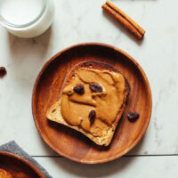 Slice of gluten-free toast topped with cinnamon raisin peanut butter