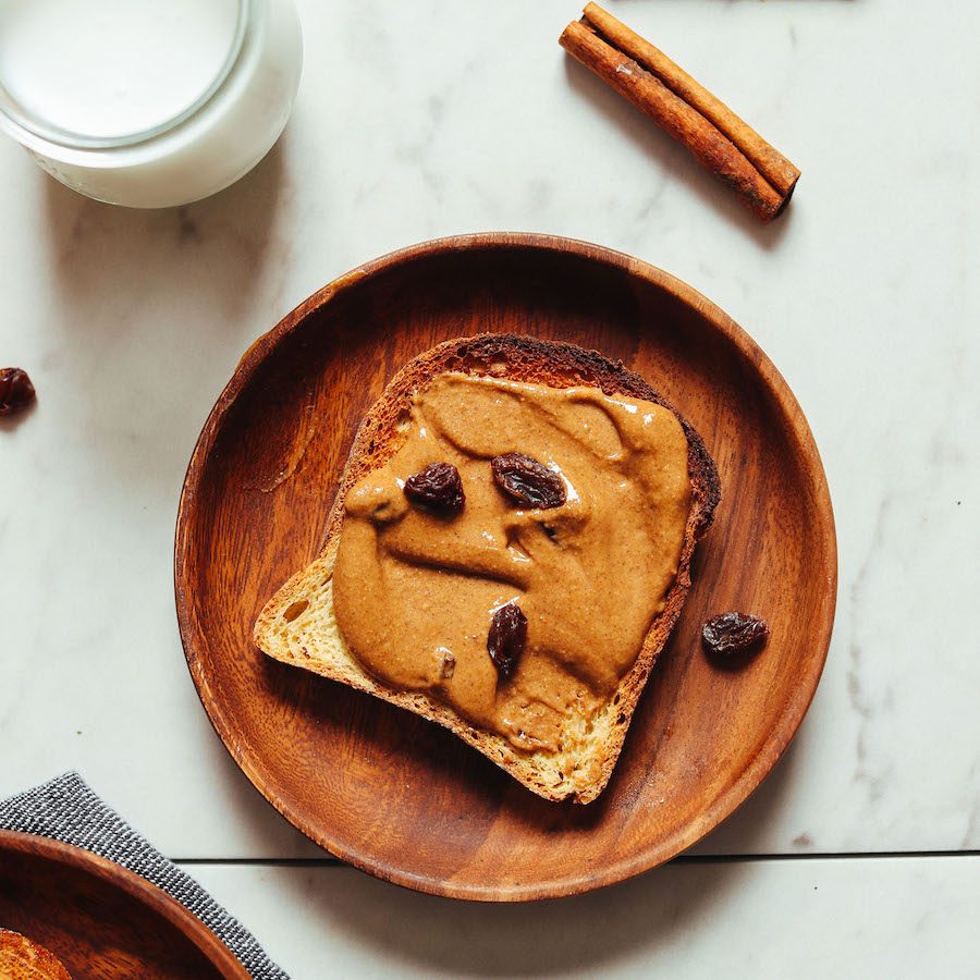 Slice of gluten-free toast topped with cinnamon raisin peanut butter
