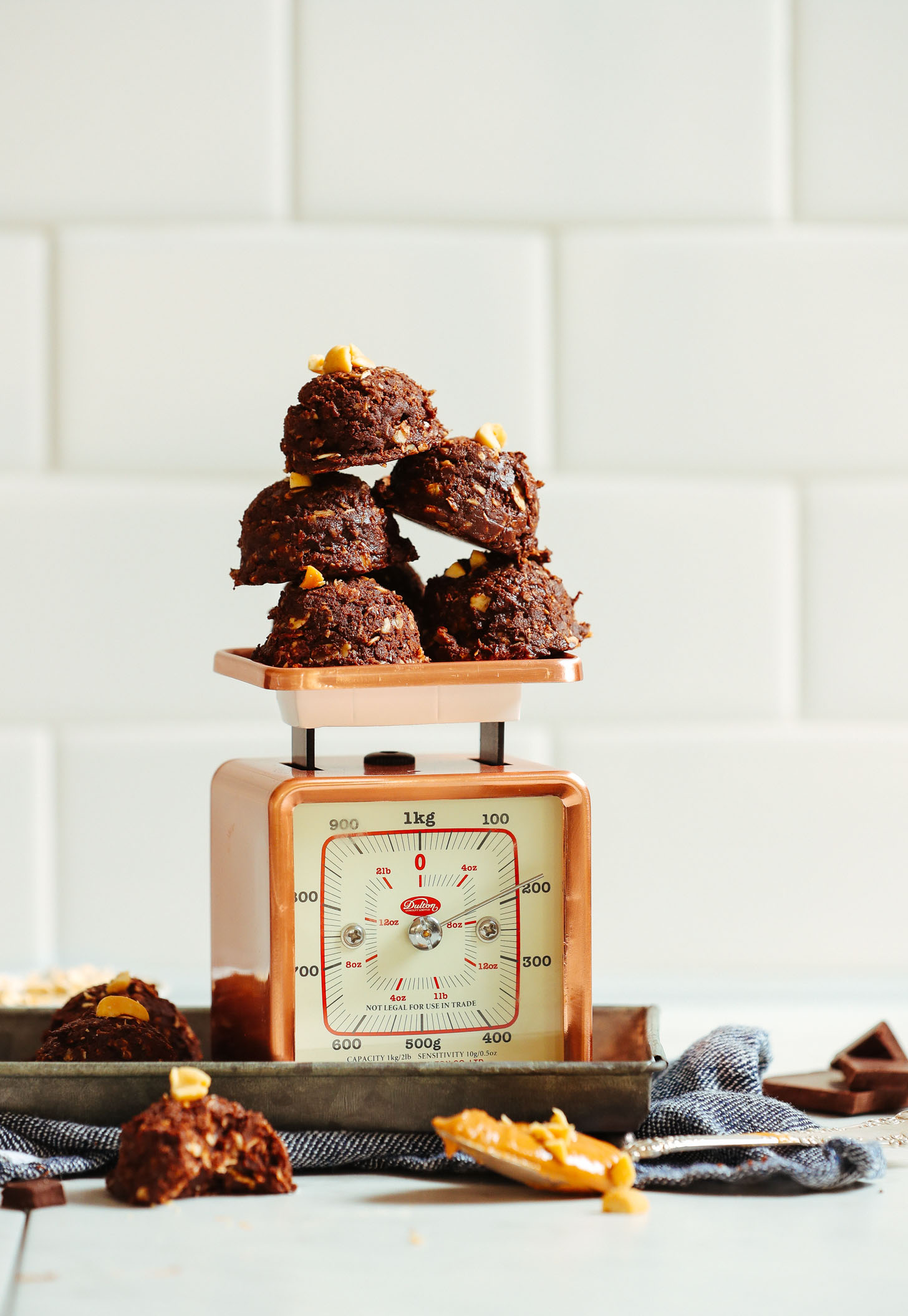 Batch of our Vegan Peanut Butter No Bake Cookies recipe resting on a vintage scale