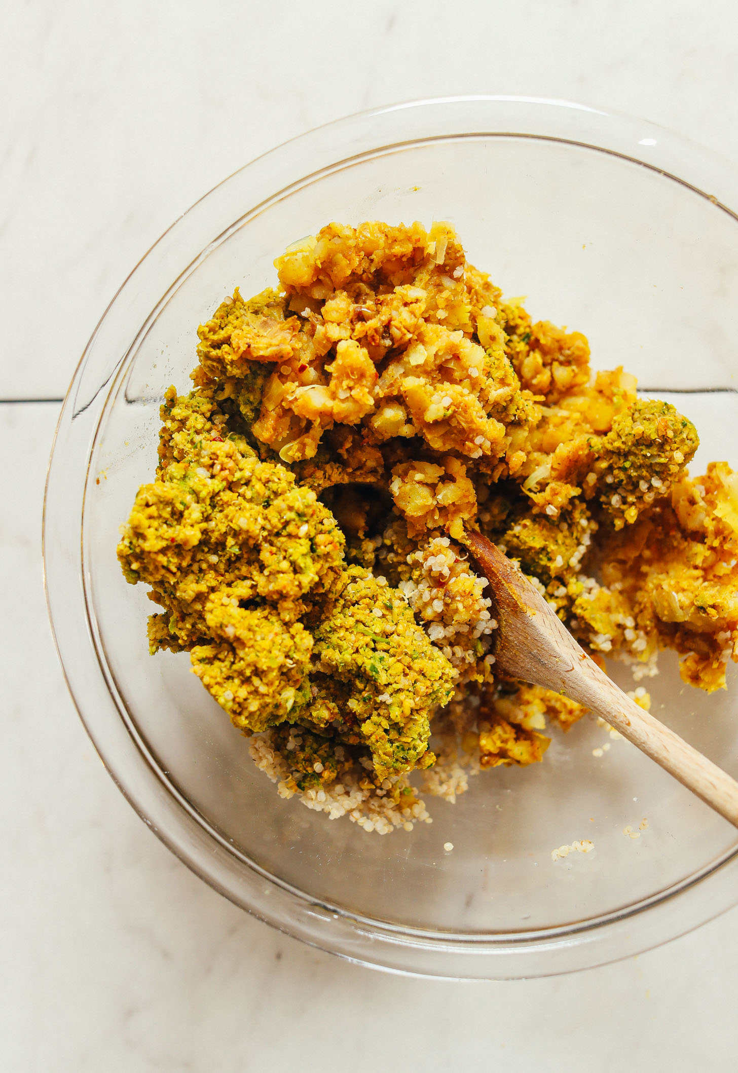 Stirring together ingredients for homemade vegan Curried Chickpea Burgers