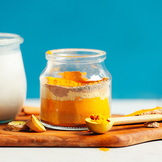 Jar of Golden Milk Mix with the spices arranged in layers