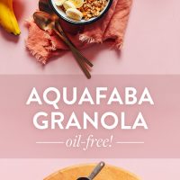 Platter of ingredients and bowls and baking sheet of our Oil-Free Aquafaba Granola recipe