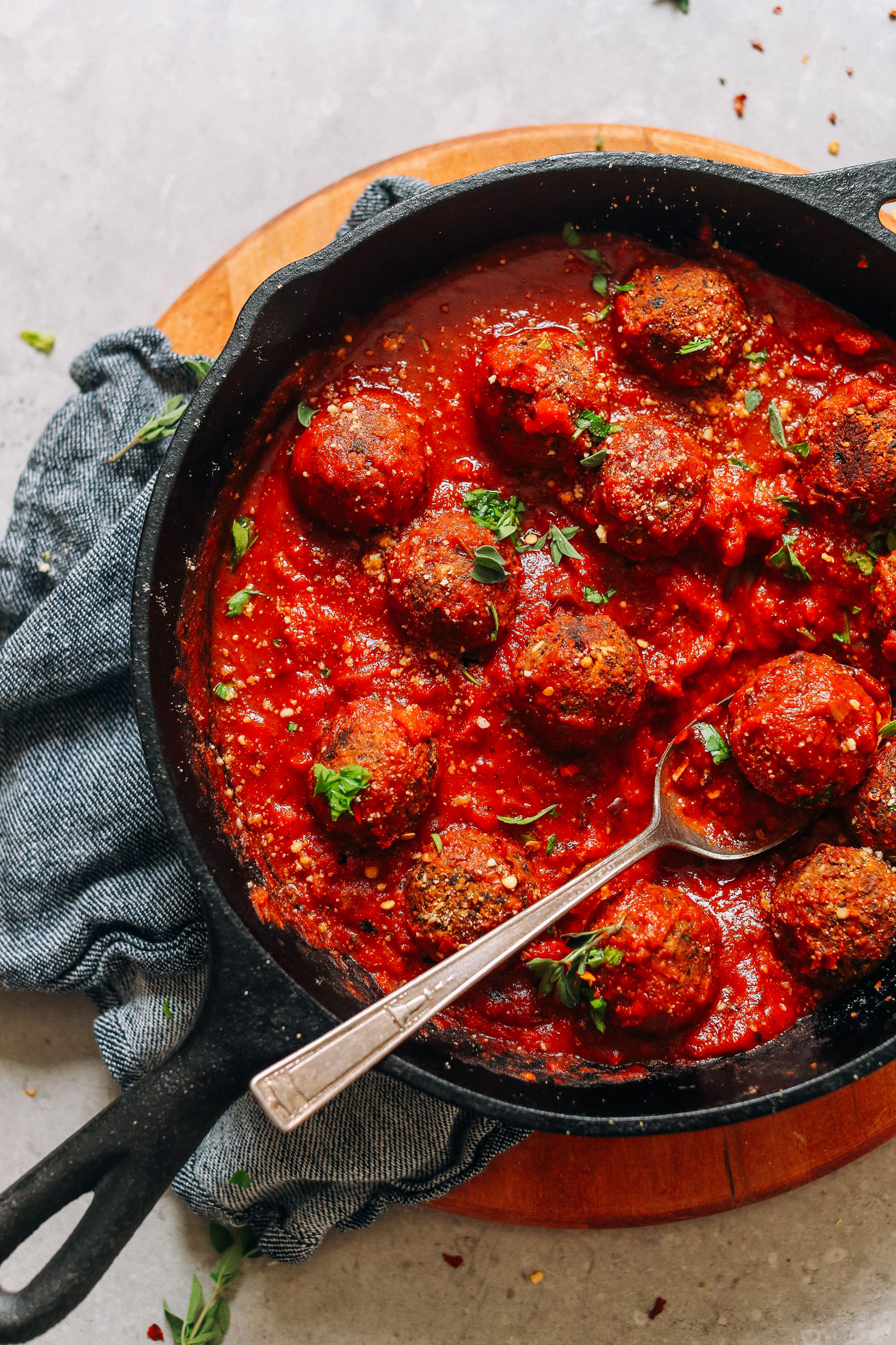 Skillet filled with gluten-free vegan homemade "meatballs" in marinara sauce