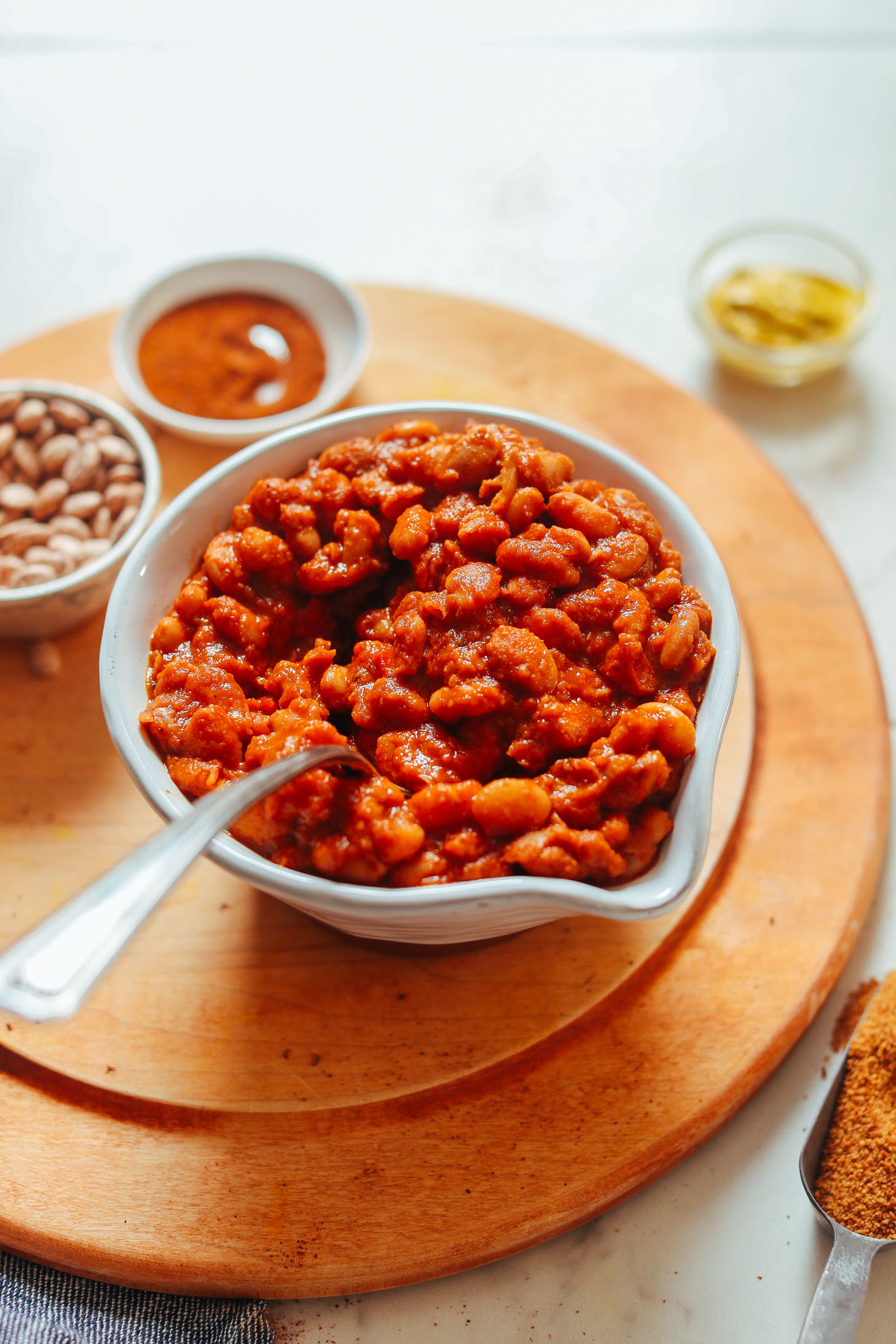Grabbing a spoonful of vegan gluten-free BBQ Baked Beans